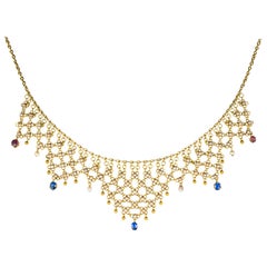 Collier franais ancien en or orn de perles ajoures, saphirs et rubis
