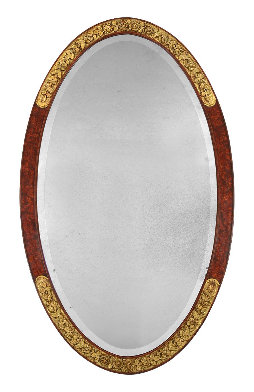 French antique oval mirror period Art Deco, circa 1925. Antique frame patina marble brown with ornament roses and flowers, gilding to the gold leaf. Antique wood back. Antique mercury glass beveled mirror. Measures: Antique frame width: 5.5 cm.