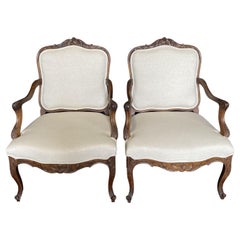 French Antique Pair of Intricately Carved Louis XV Walnut Arm Chairs