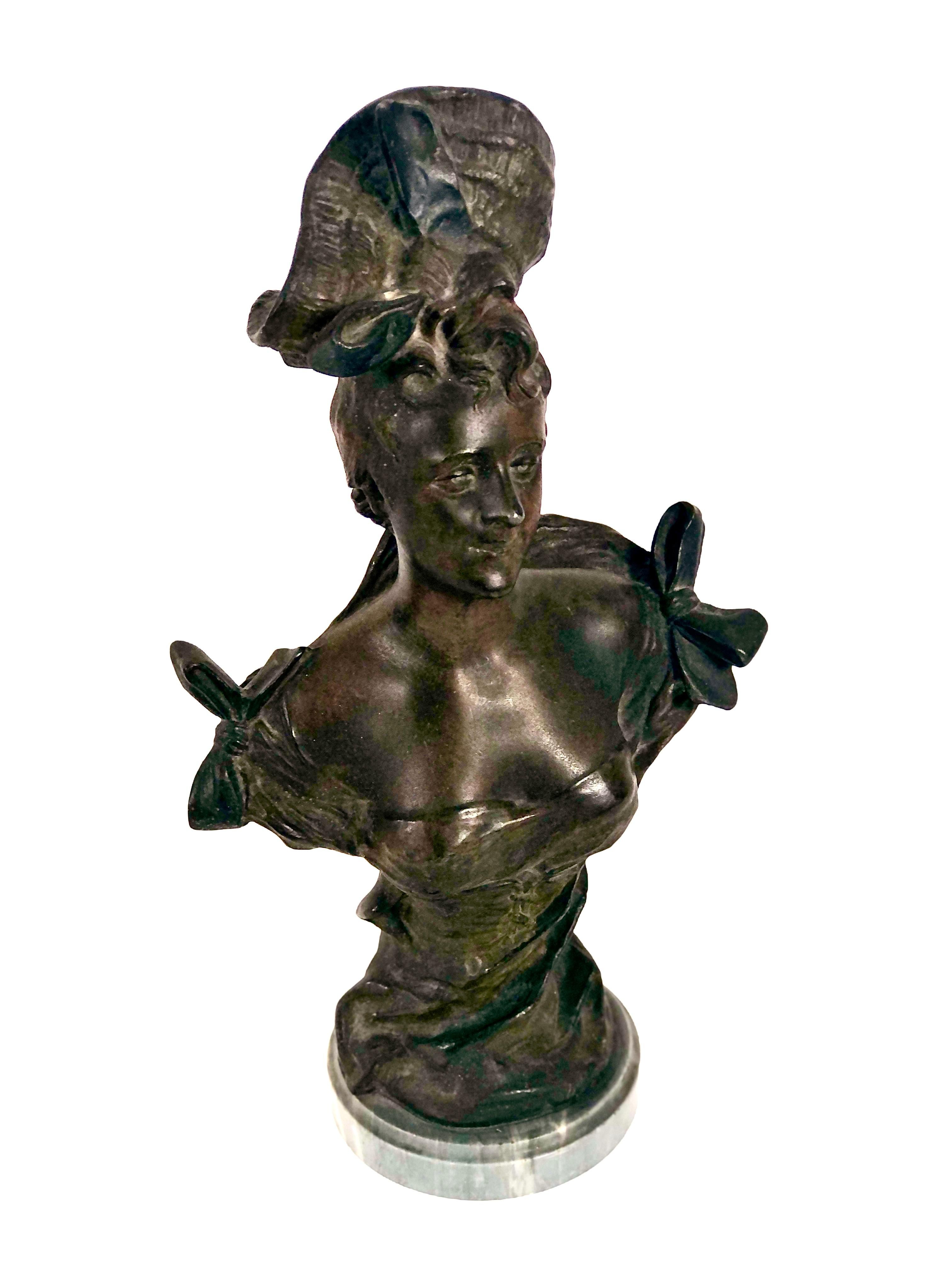 Antique Elegance with an Art Nouveau Twist ! 
Embrance the timeless beauty of the 19th century French School with this exquisite Art Nouveau bust sculpture. A captivating bust of a woman in patinated bronze, adorned with a classic ribbon-attached