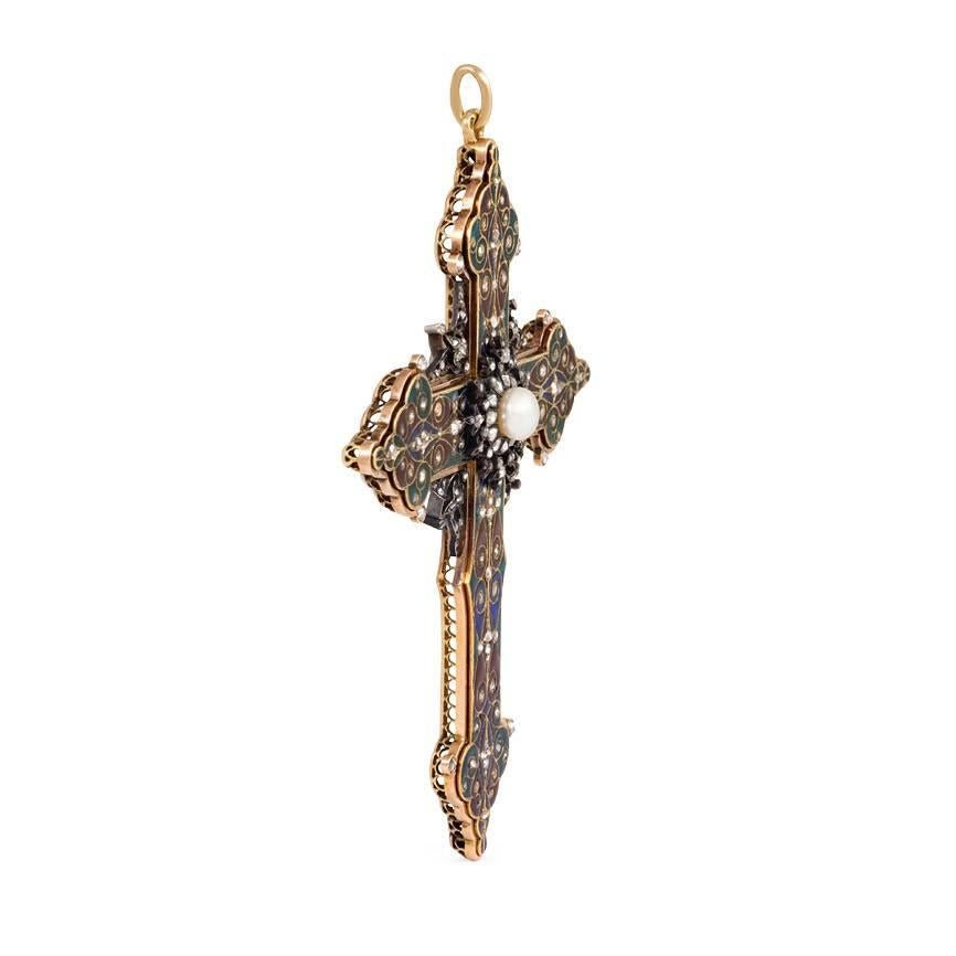 An antique Renaissance revival multi-colored enamel and rose diamond cross pendant centering on a pearl and diamond cluster, with silver filigreed details and pierced undergallery, in 18k gold.  France 