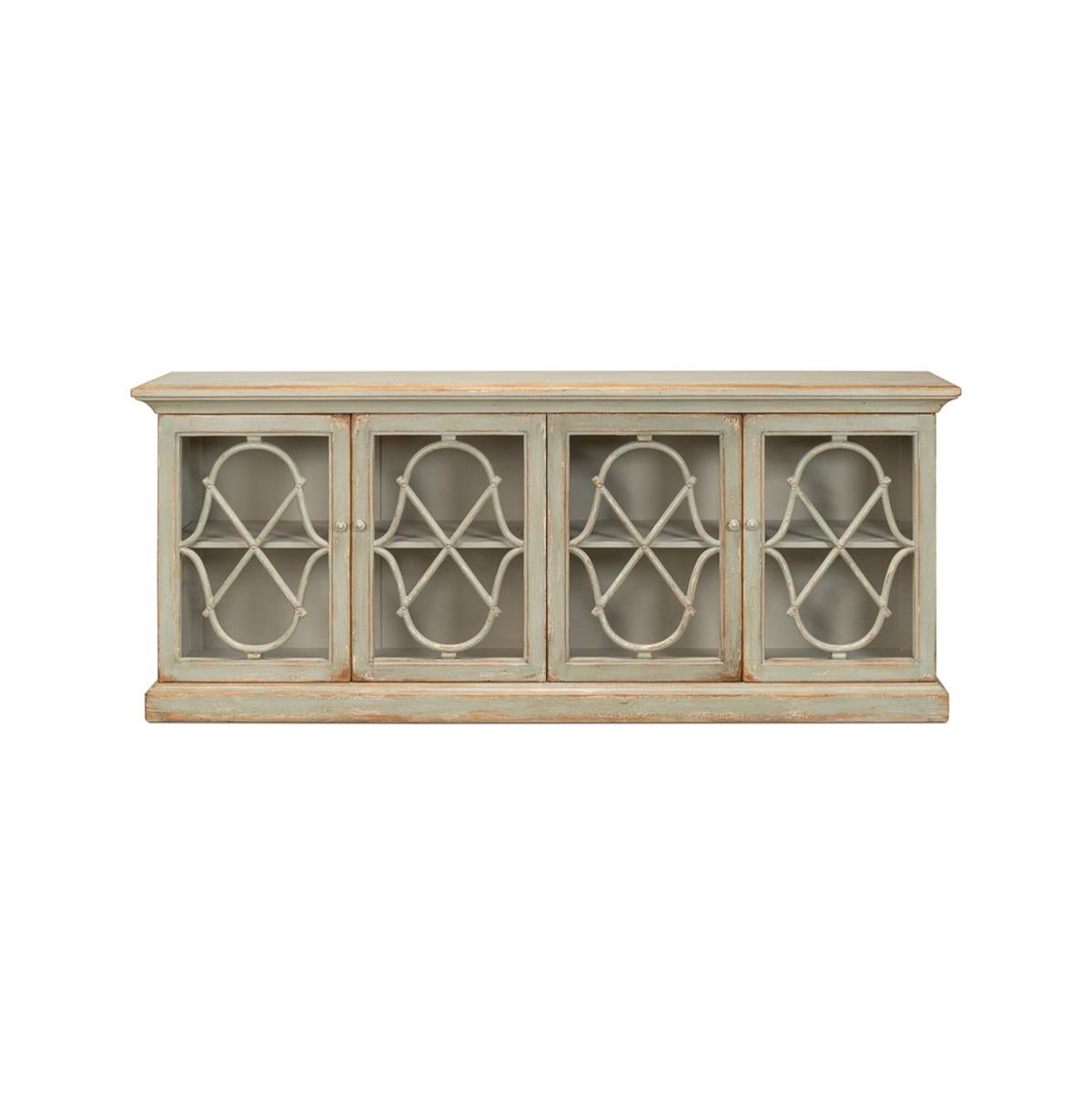 Inspired by the 19th century French antique, this reclaimed pine sideboard has an emphasis on high drama and a high function, set apart with a graceful, feminine fretwork motif.

With a flat rectangular top above four doors with openwork details in