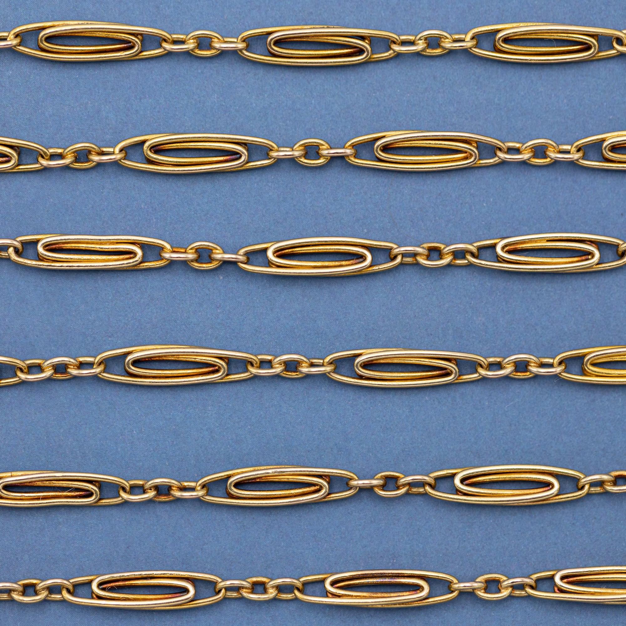 For sale is this lovely French 18 K yellow gold necklace. This elegant chain consists of alternating simpler and fancy paperclip looking links. This lovely chain necklace bears a makers mark, while the spring ring is hallmarked with a French boar