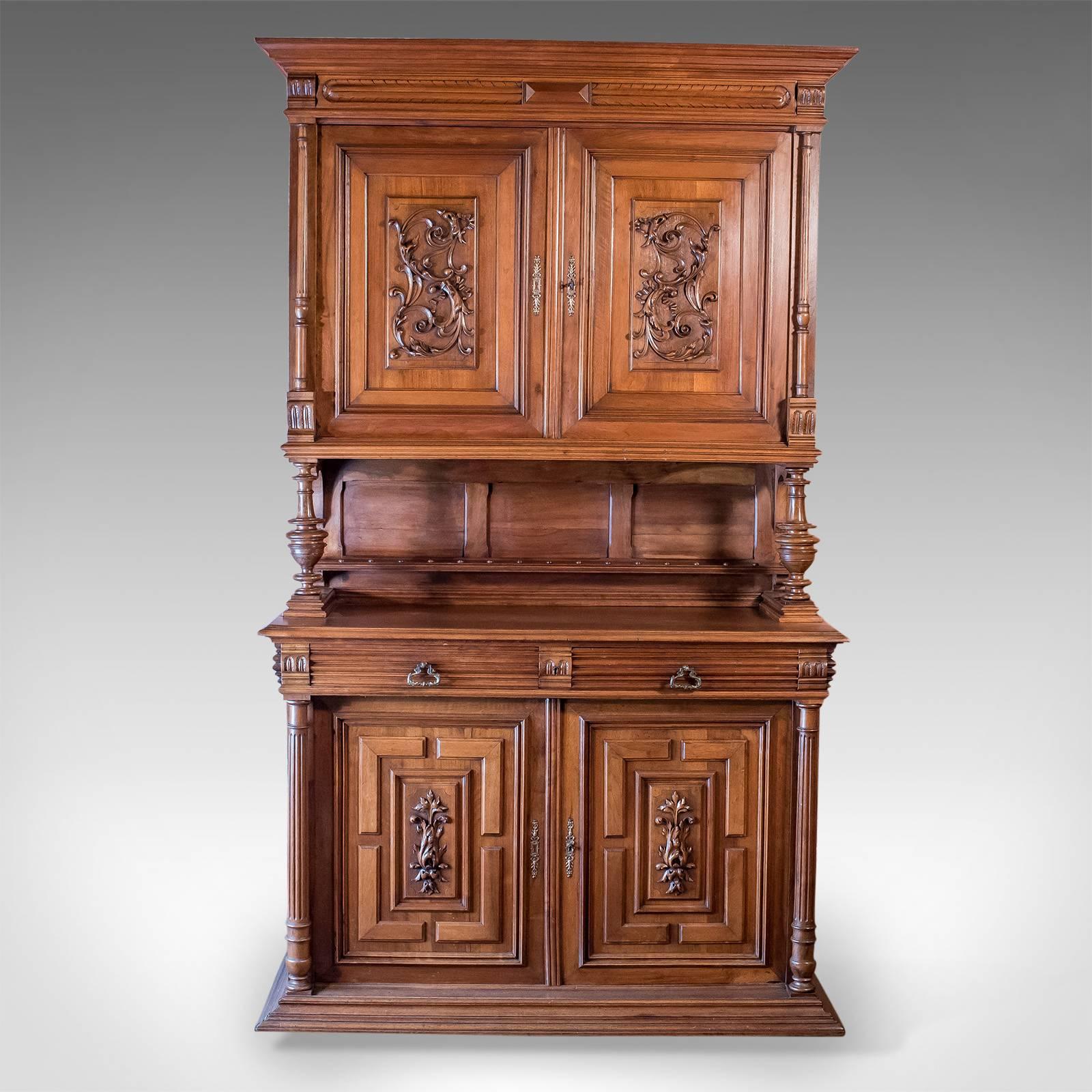 This is an impressive French antique show cabinet dating to the late Victorian period, circa 1890.

A fine and rare example in very good order
Crafted in choice cuts of walnut
Good colour and desirable grain interest
Working locks and keys to