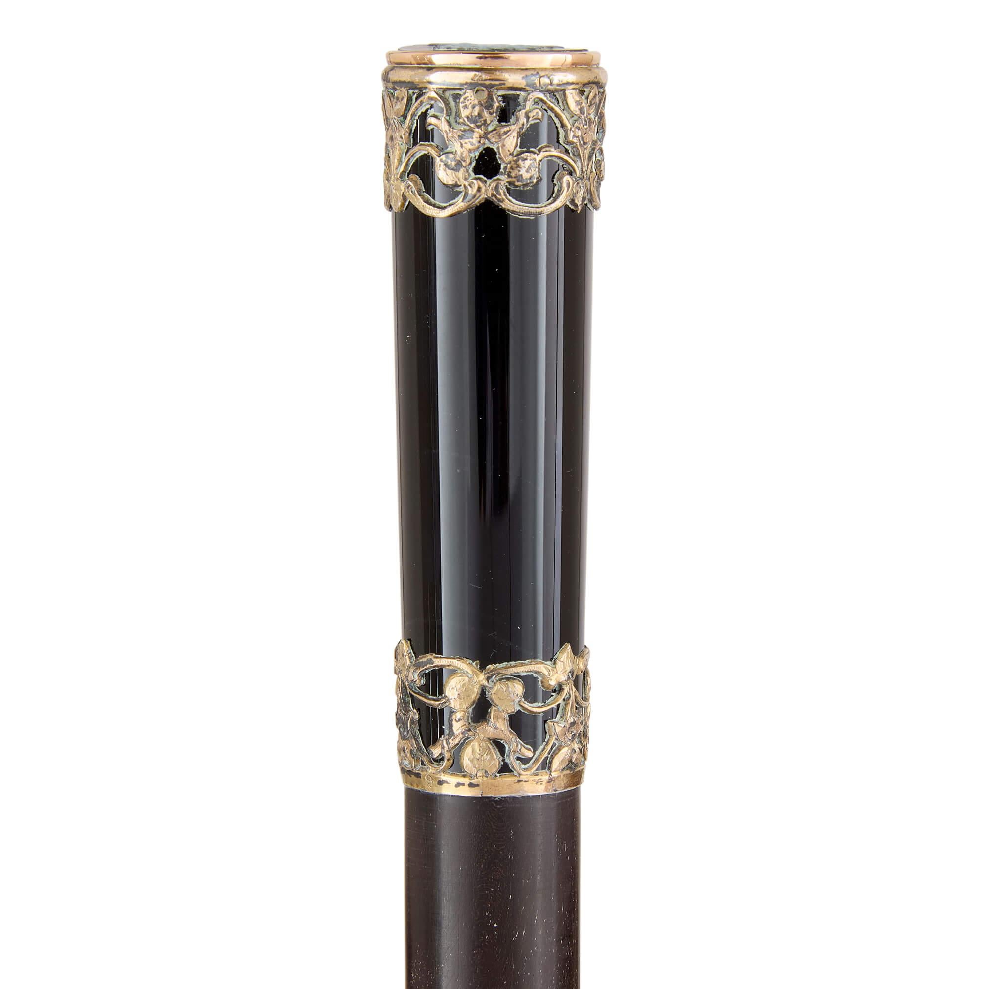 French antique silver-gilt and onyx cane 
French, c. 1900 
Height 88cm, diameter 2.5cm

Superbly crafted in late 19th century France, this exquisite cane exemplifies superior craftsmanship, incorporating premium materials with remarkable precision