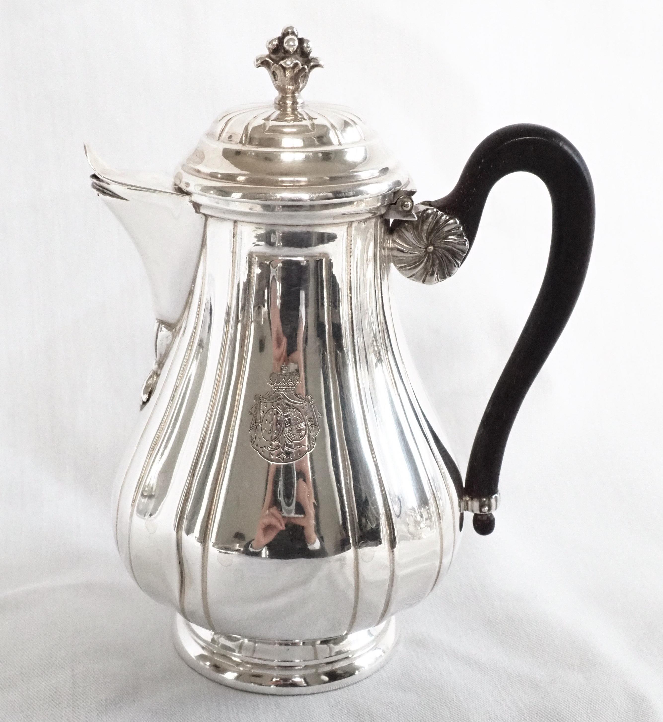 Regency style sterling silver two-person coffee and tea set, beautiful 18th century style pattern decorated with a French coat of arms, a crown of Duke on top (highest French aristocracy grade after Prince).
Our set is composed of 4 pieces - a