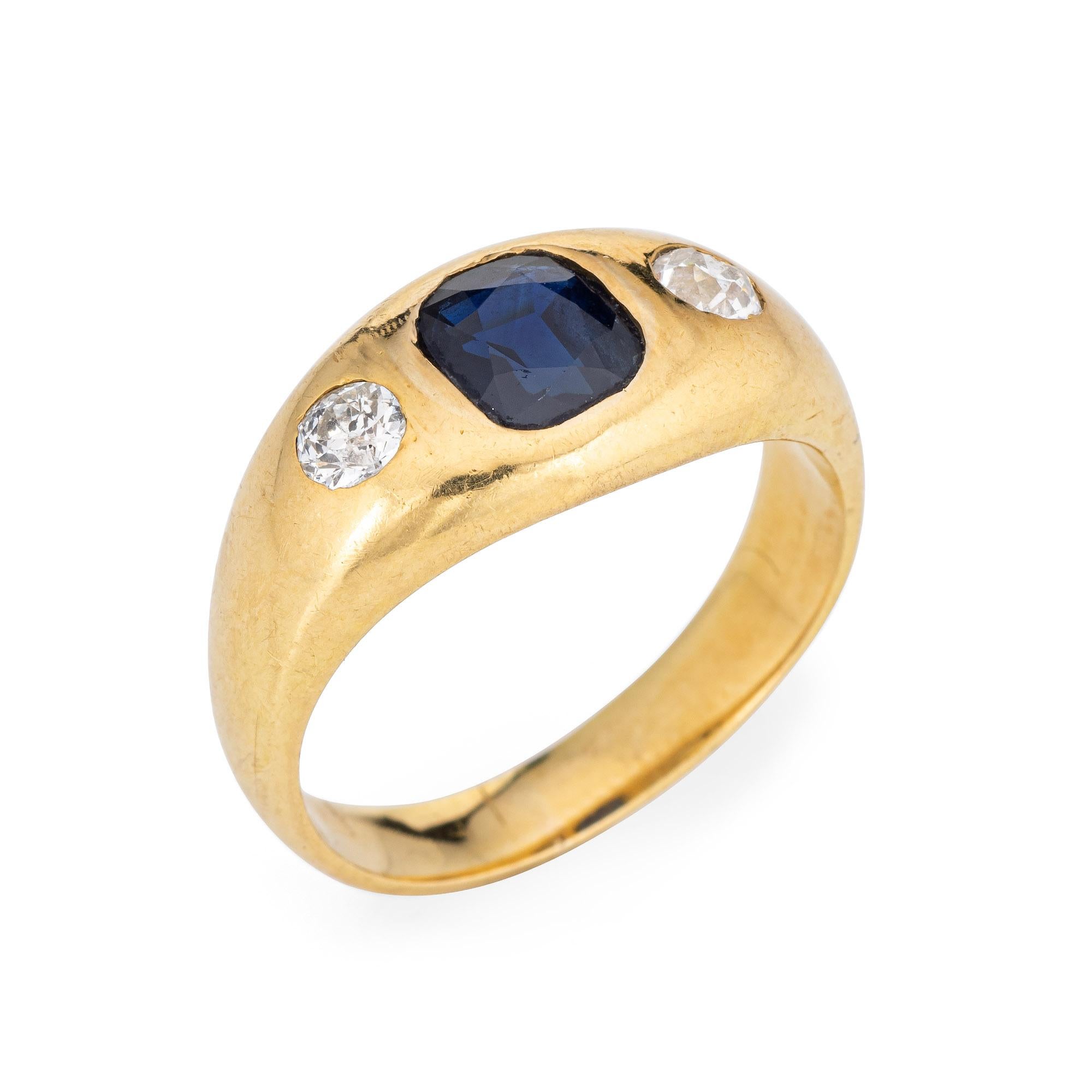 Stylish French antique Victorian sapphire & diamond ring (circa 1890s to 1900s) crafted in 18 karat yellow gold. 

Square cushion cut blue sapphire measures 7mm x 6mm (estimated at 1.25 carats). Two estimated 0.12 carat old mine cut diamonds total