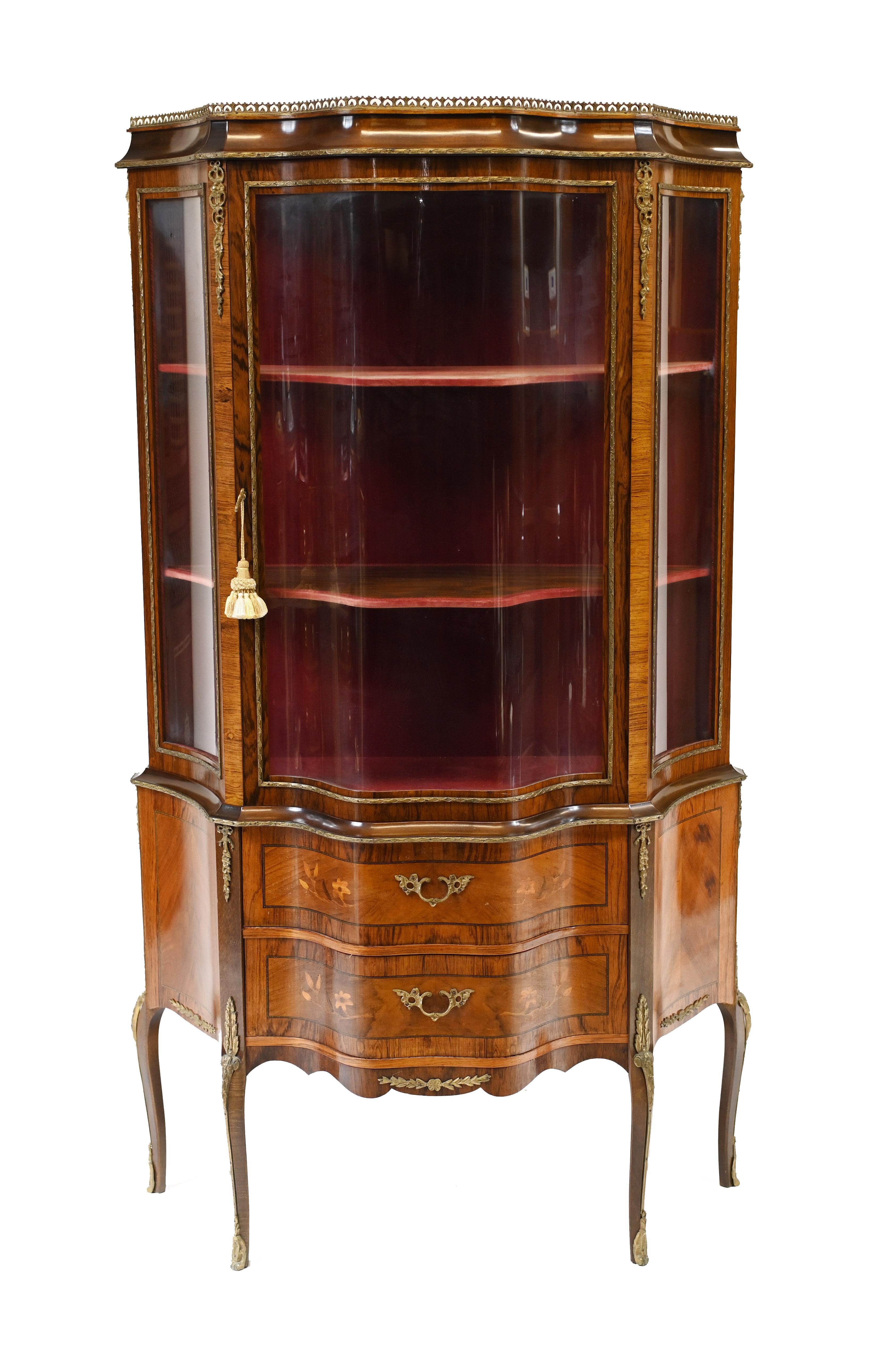 Elegant antique French vitrine on cabriole legs
Features crossbanded drawers and sides
Circa 1880
Great china cabinet or bijuouterie perfect for displaying decorative pieces
Bought from a dealer at Les Puces antiques market in Paris.





