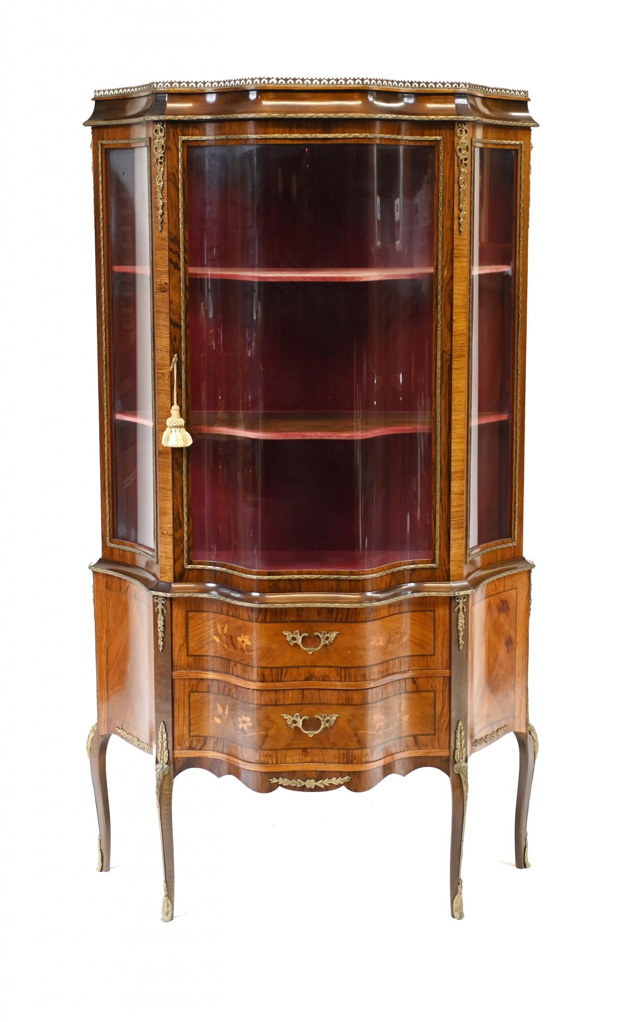 Elegant antique French vitrine on cabriole legs
Features crossbanded drawers and sides
Circa 1880
Great china cabinet or bijuouterie perfect for displaying decorative pieces
Bought from a dealer at Les Puces antiques market in Paris 
Some of