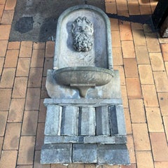 French Antique Wall Fountain in Carved Limestone with Mask, Early 20th Century