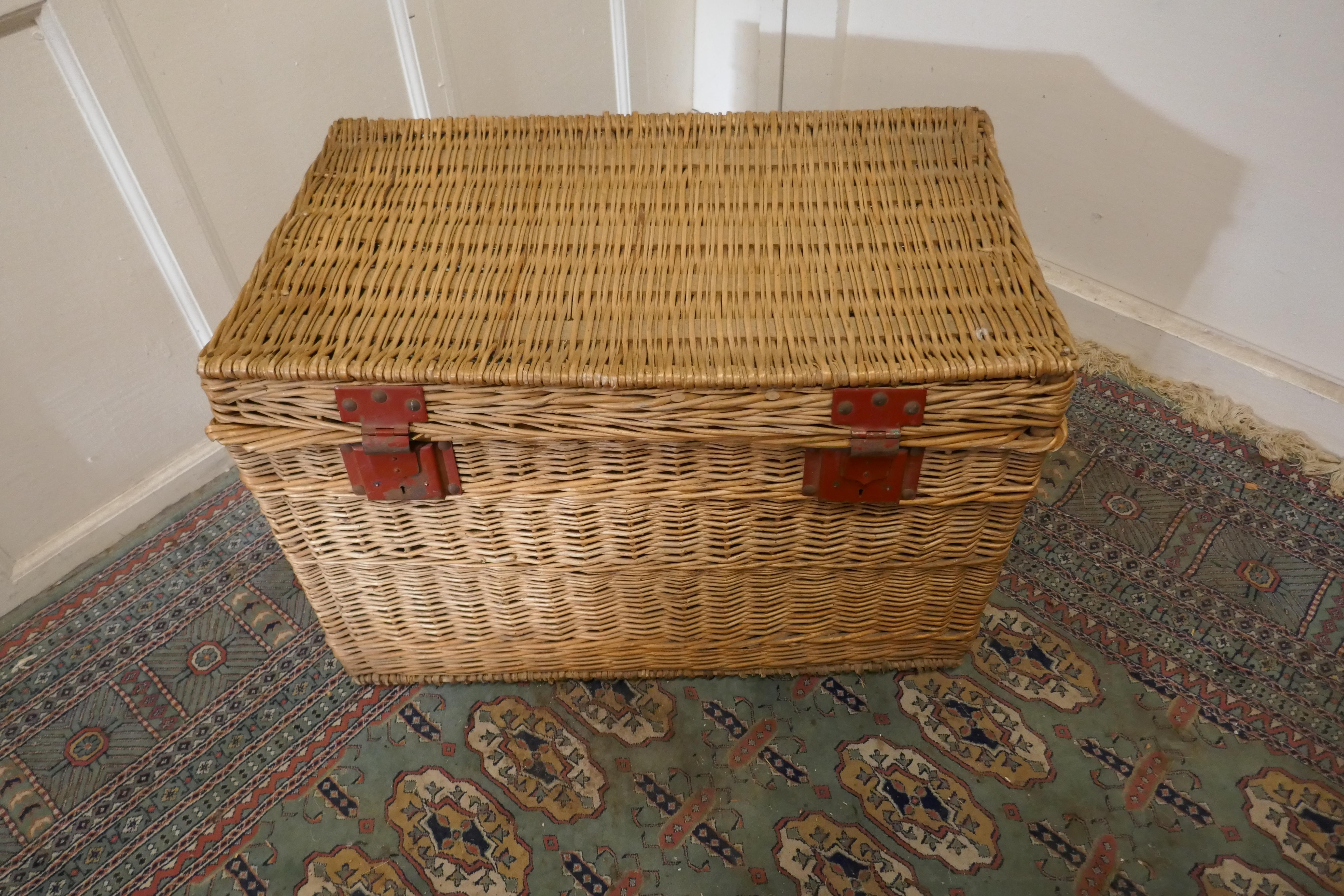 French antique Wicker laundry basket or Linen Hamper

This is an excellent example and in remarkably good condition for its age, the basket originates from a French Hotel, it has woven carrying handles
The Hamper has a good strong lid and metal