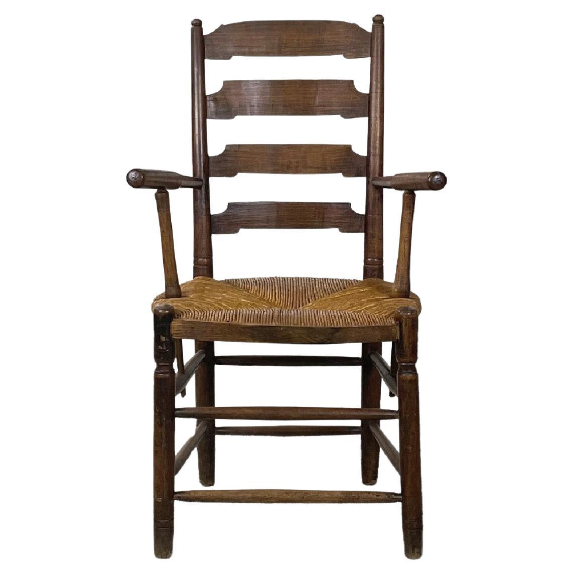 French antique wood oak and straw chair with armrests decorations, late 1800s For Sale