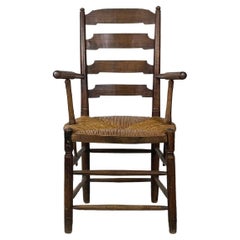 Chaise ancienne en bois de chêne et paille avec accoudoirs décoratifs, fin des années 1800