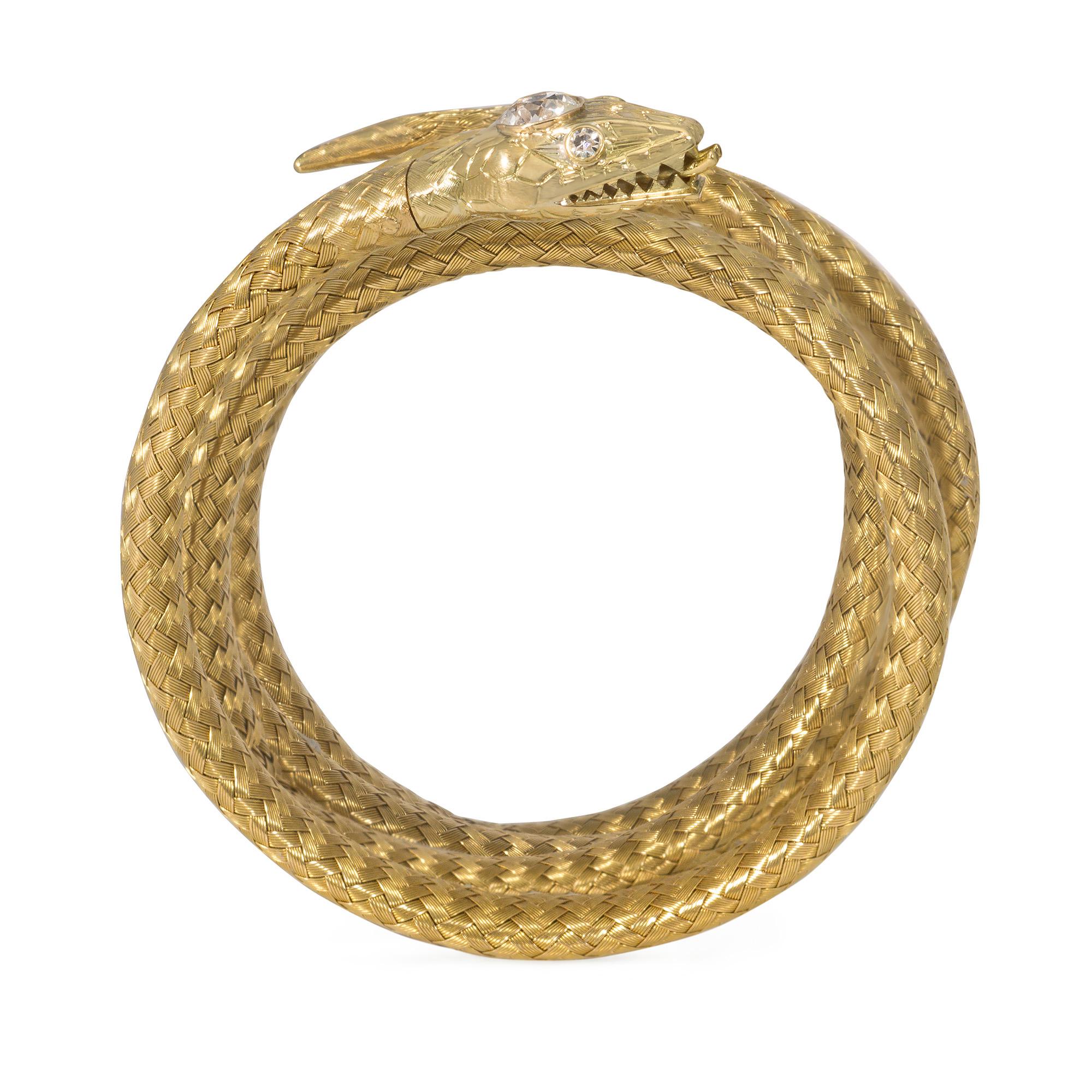 An antique late 19th century woven gold and diamond bracelet, exquisitely designed as a flexible coiled serpent with a finely detailed head set with an old European-cut diamond and diamond-accented eyes, in 18k.  France.  Adjustable design allows
