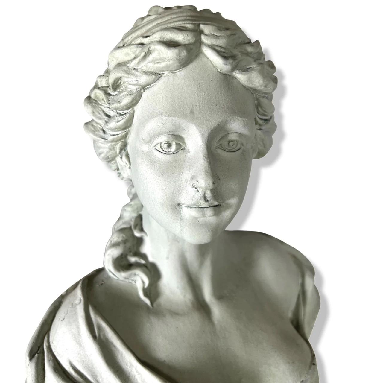 This elegant Antoinette style bust is made from faux stone, and is moderately heavy, yet functional enough to move around and place with ease. It is brilliantly cast, and would be well suited to a garden table display or interior formal lounge. A