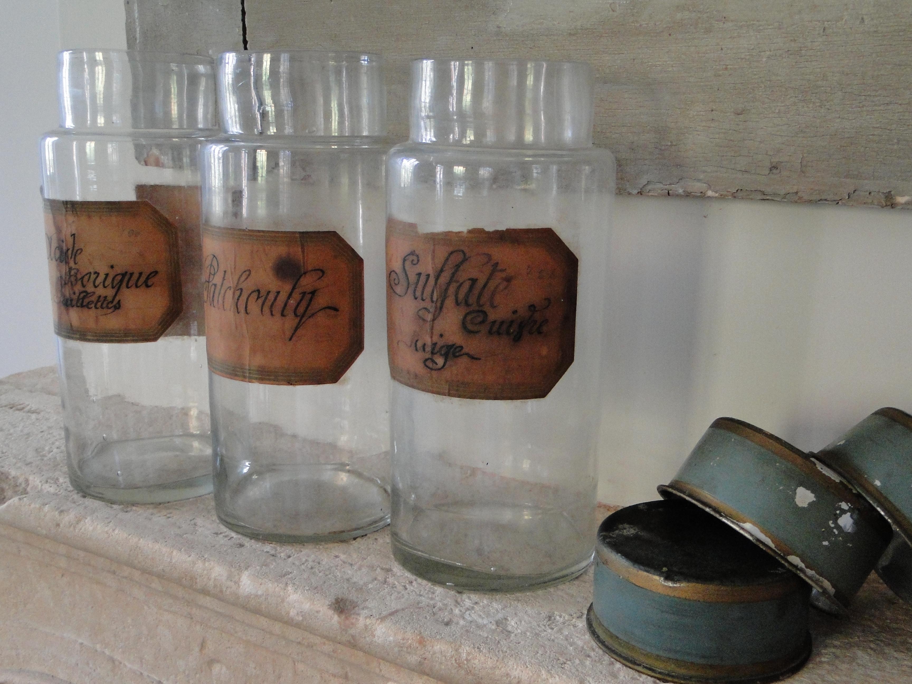 Gilt French Apothecary Glass Jars with Original Handwritten Label and Painted Tin Lid For Sale