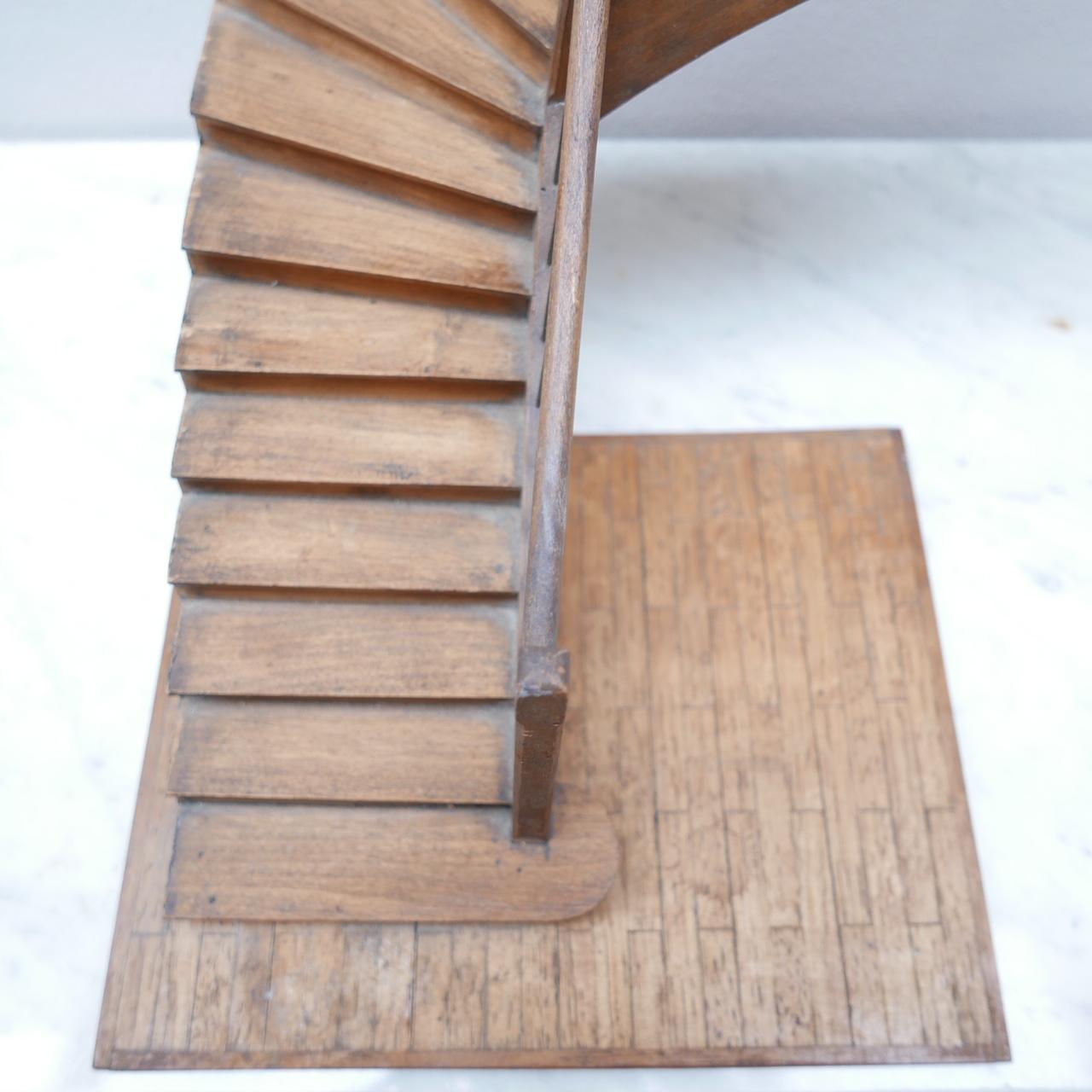 French, likely midcentury apprentice staircase model. 

Sculptural and decorative. 

These were historically used by carpenters apprentices to demonstrate their skills. 

Unsure of which wood was used for construction.
  