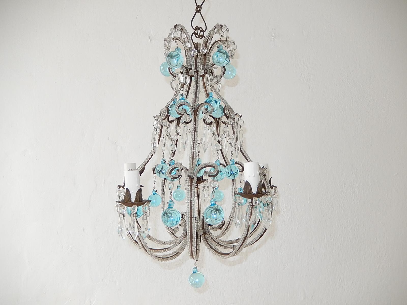 Housing 5 lights. Will be rewired with certified UL US sockets for the USA or certified sockets for other countries and ready to hang. Double beaded throughout. Adorning vintage hand tied crystal prisms and aqua blue Murano balls. Adding another 24