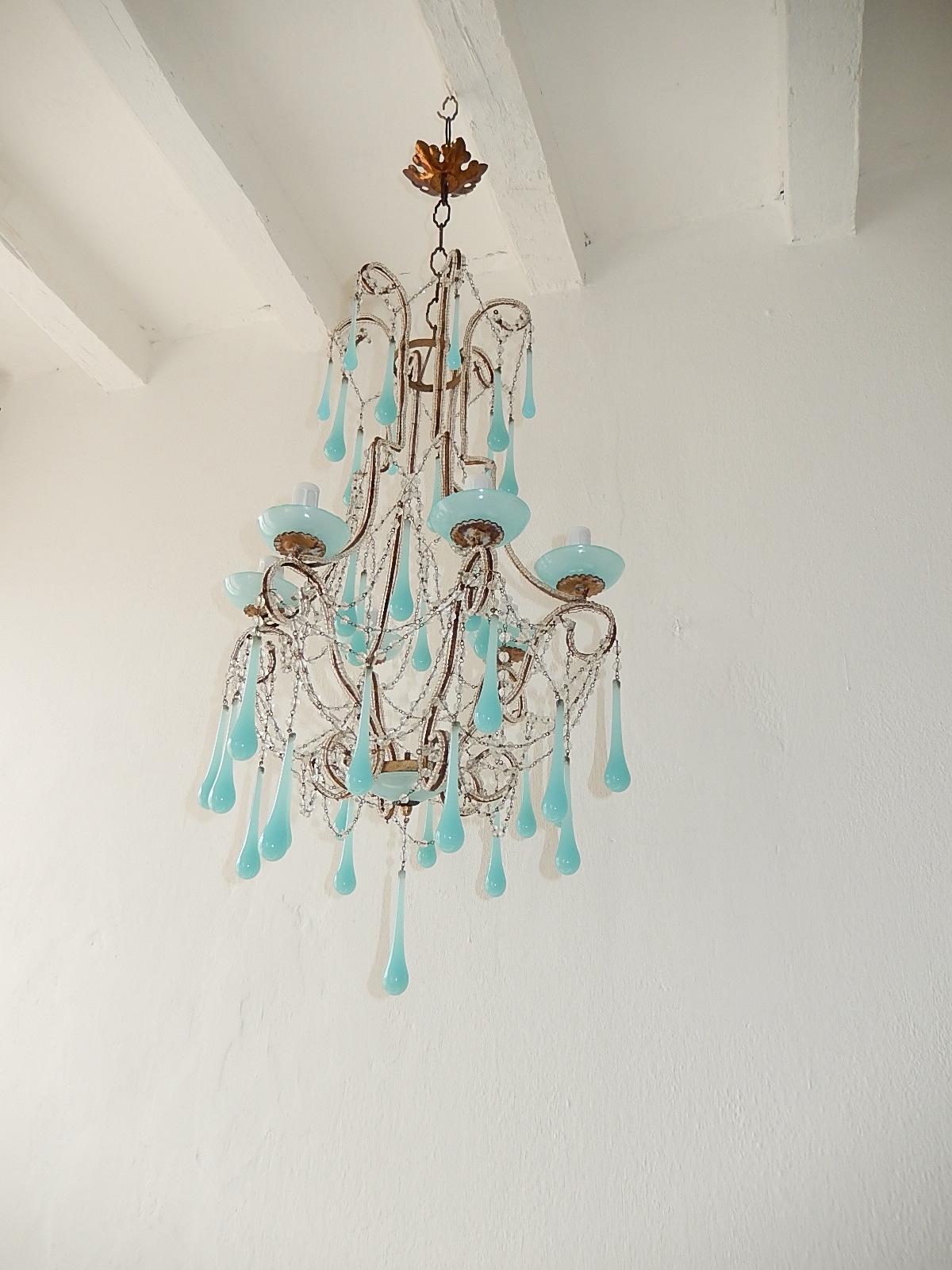 Housing six lights sitting in blue Opaline bobeches. Will be rewired with certified UL US sockets for the USA and certified sockets for rest of countries, ready to hang. Double beaded throughout with swags and swags of crystal balls, each and every