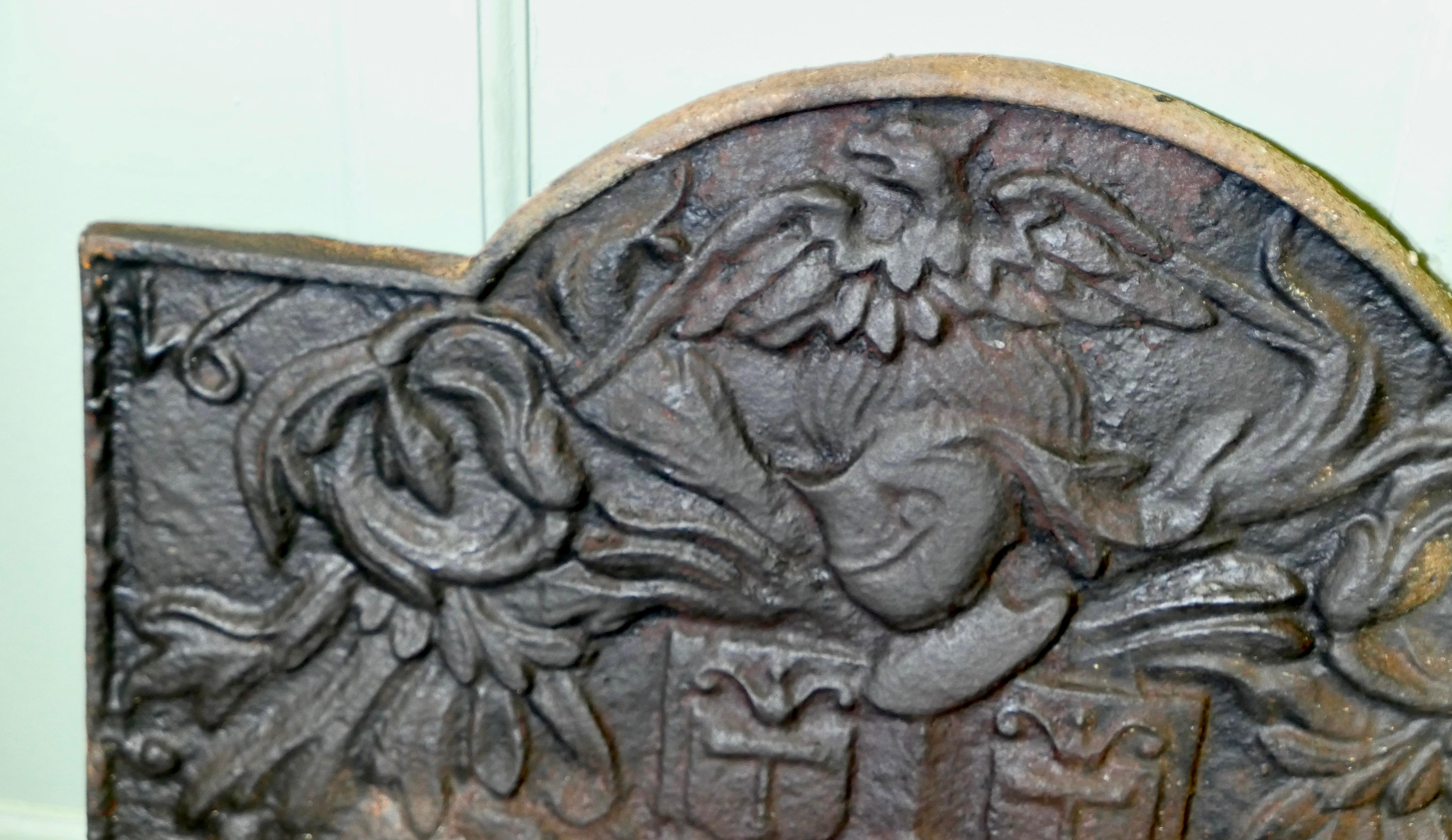 Iron French Arch Top Fire Back. Armour and Eagle For Sale