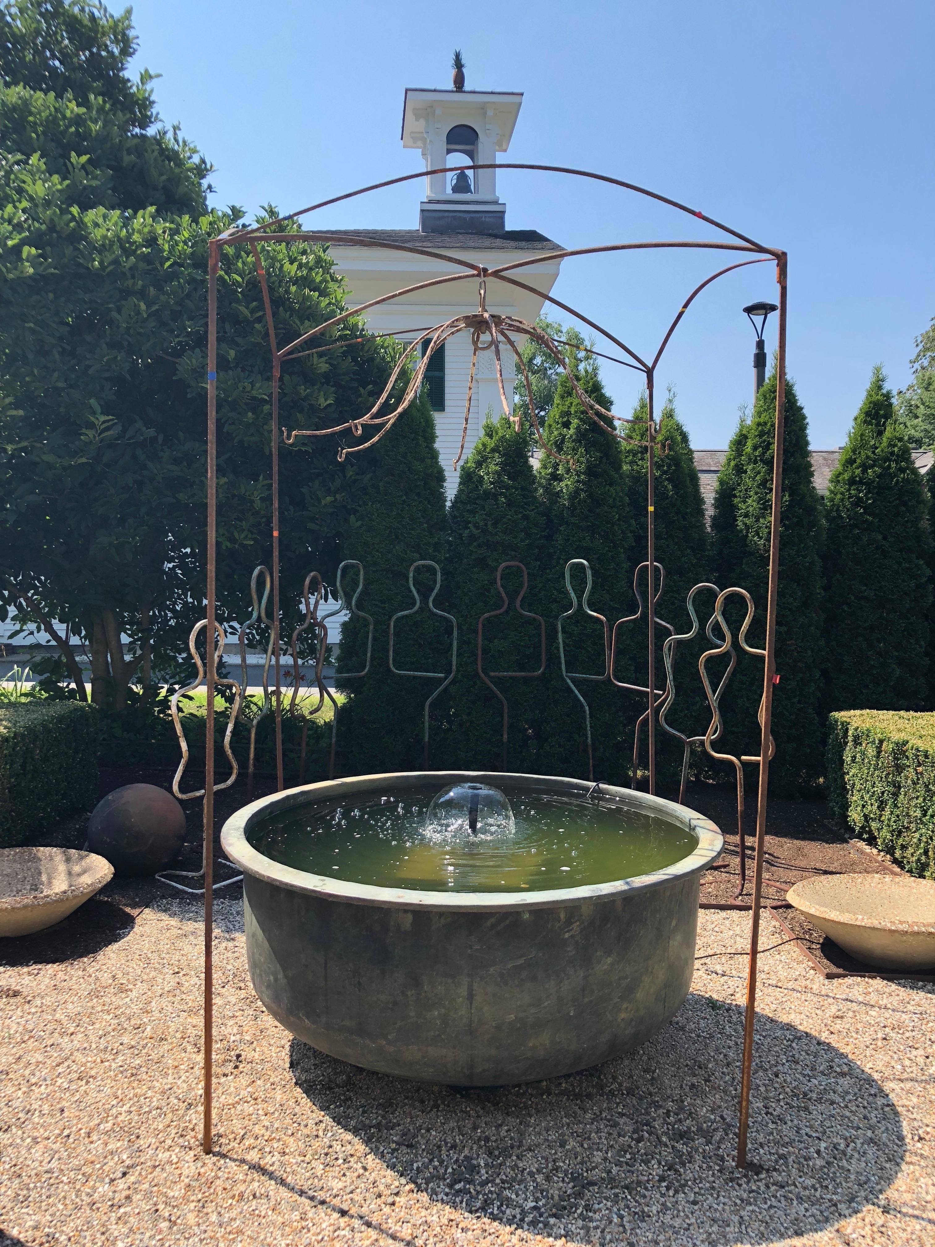 This combination of pieces is truly stunning. The 19th century square wrought iron arbor has been heightened by seamlessly adding several feet of matching pointed steel stakes to each leg that makes insertion into the ground a breeze. The