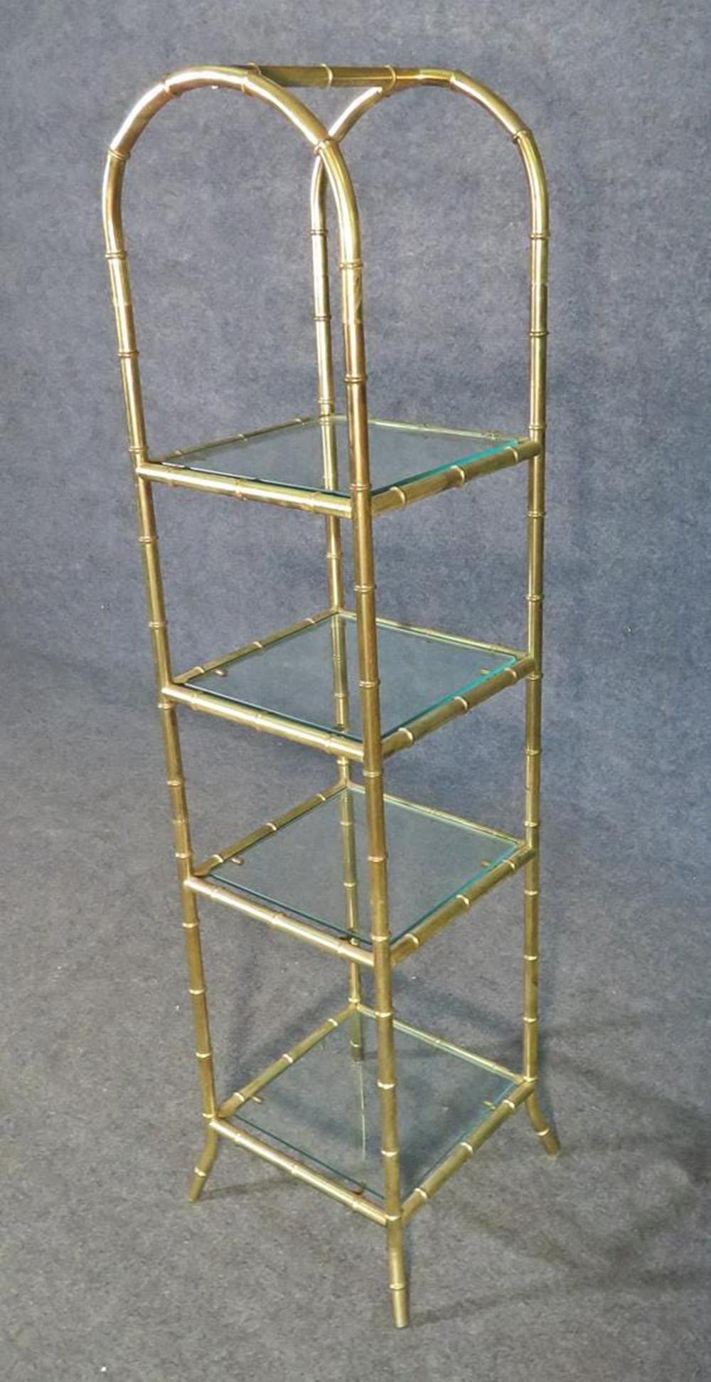 This is a gorgeous French 1950s era Bagues style or perhaps made by Bagues, petite etagere. Perfect for use in a powder room or any other space requiring shelving with minimal space. The piece is in good original condition. The etagere measures 57
