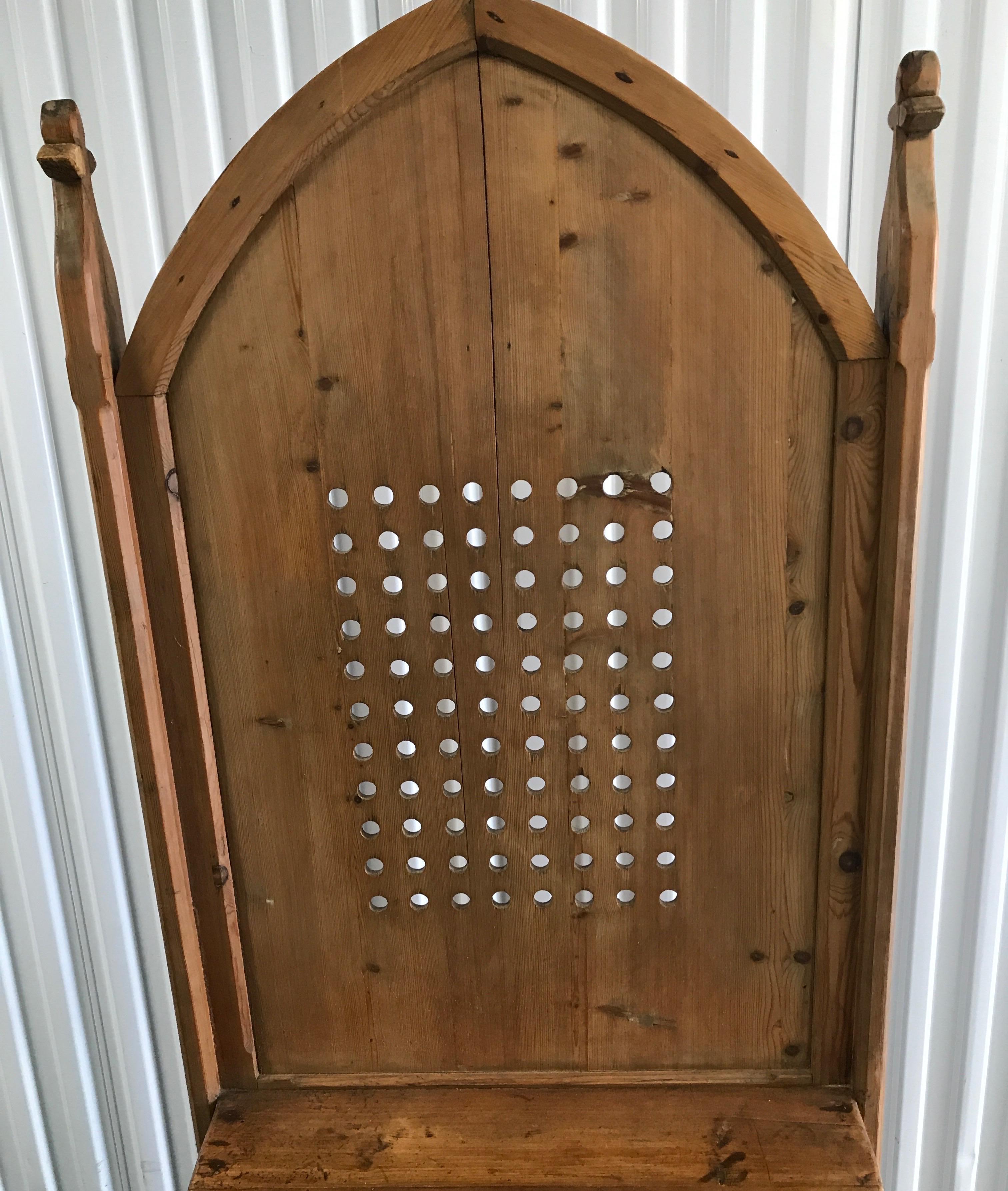 Antique French confessional with arched top and fleur-de-lis on each side. Would make a unique screen/divider.