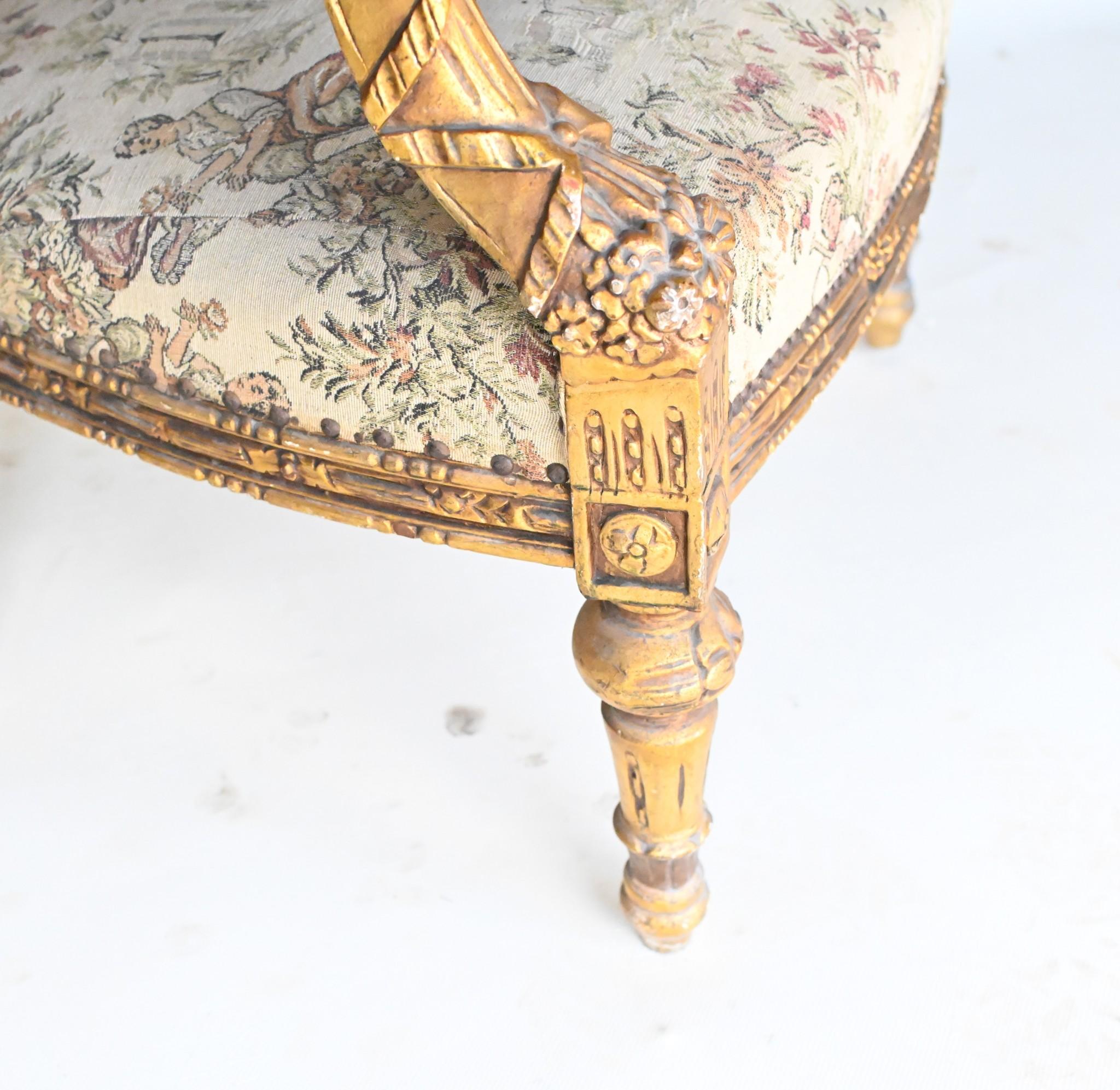 Gorgeous pair of French gilt arm chairs in the Empire manner
Very comfortable with wide arms and cushioned seats, backs and arms
Chairs have just been reupholstered hence odour and stain free
Cushioned backs, seats and arms so very