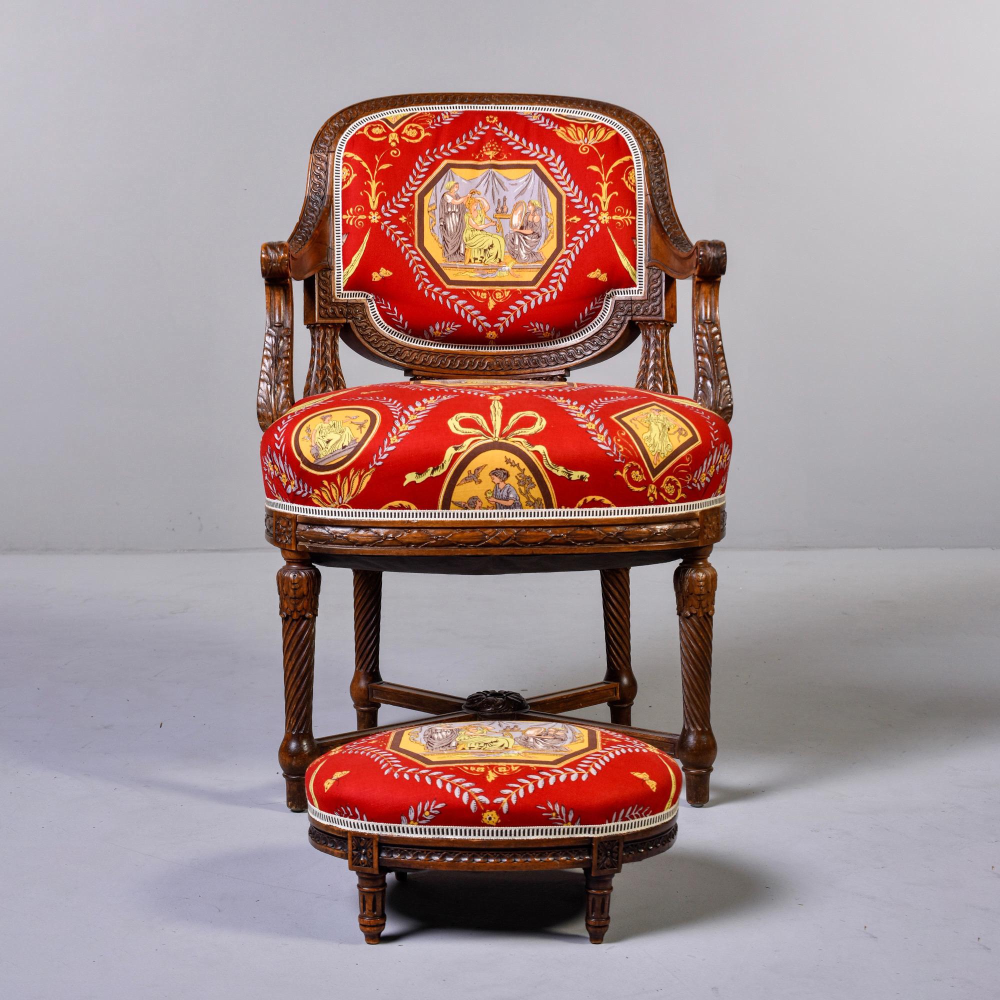 French armchair with carved details and X-form stretcher, circa 1880s. Small oval ottoman is not original to chair, but a good match. Both have been upholstered in Fortuny fabric. Sold and priced as a set.

Measures: Arm height = 27”, seat height