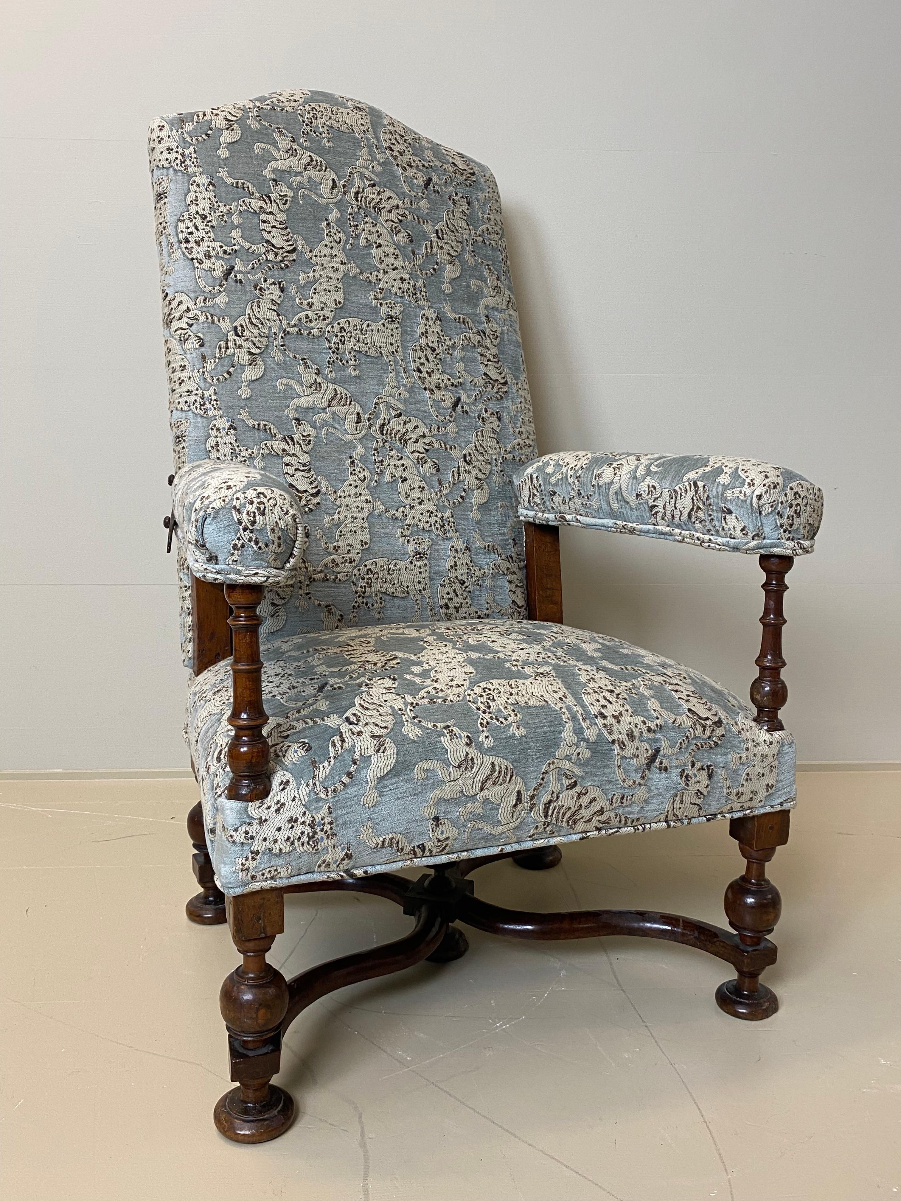 Beautiful French armchair with movable back,
good old patina and warm and worn finish,
new upholstered with Jim Thompson Fabric, Cats Pyjamas,
nice sculptured legs and stretchers