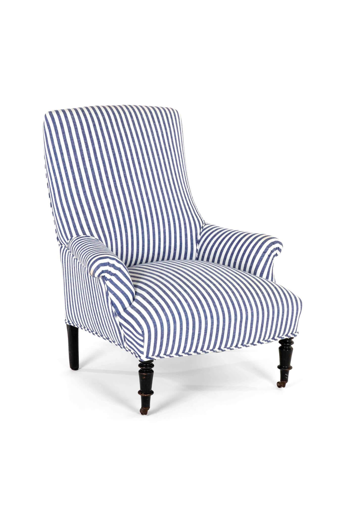 A 19th century French Napoleon III square back armchair with a tall back and a wide generous seat.

The walnut frame is raised on turned front legs with brass castors and straight legs to the back.

The armchair has been fully restored and stripped