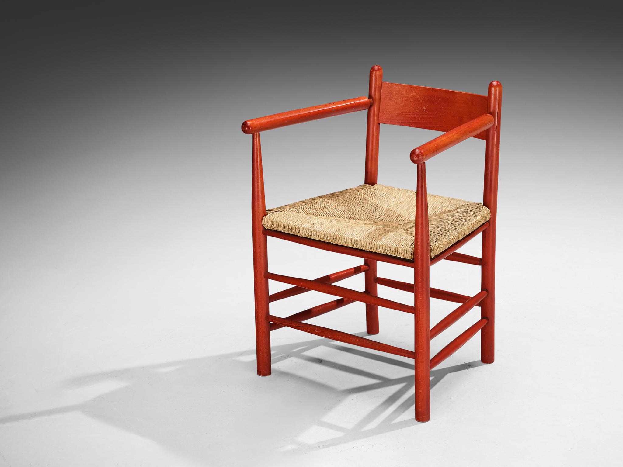 Armchair, beech, straw, France, 1960s.

Stunning French armchair with red beech frame and classic organic straw seat. This chair features a solid wooden frame, consisting of cylindrical thick legs that are connected to each other with elegant slim