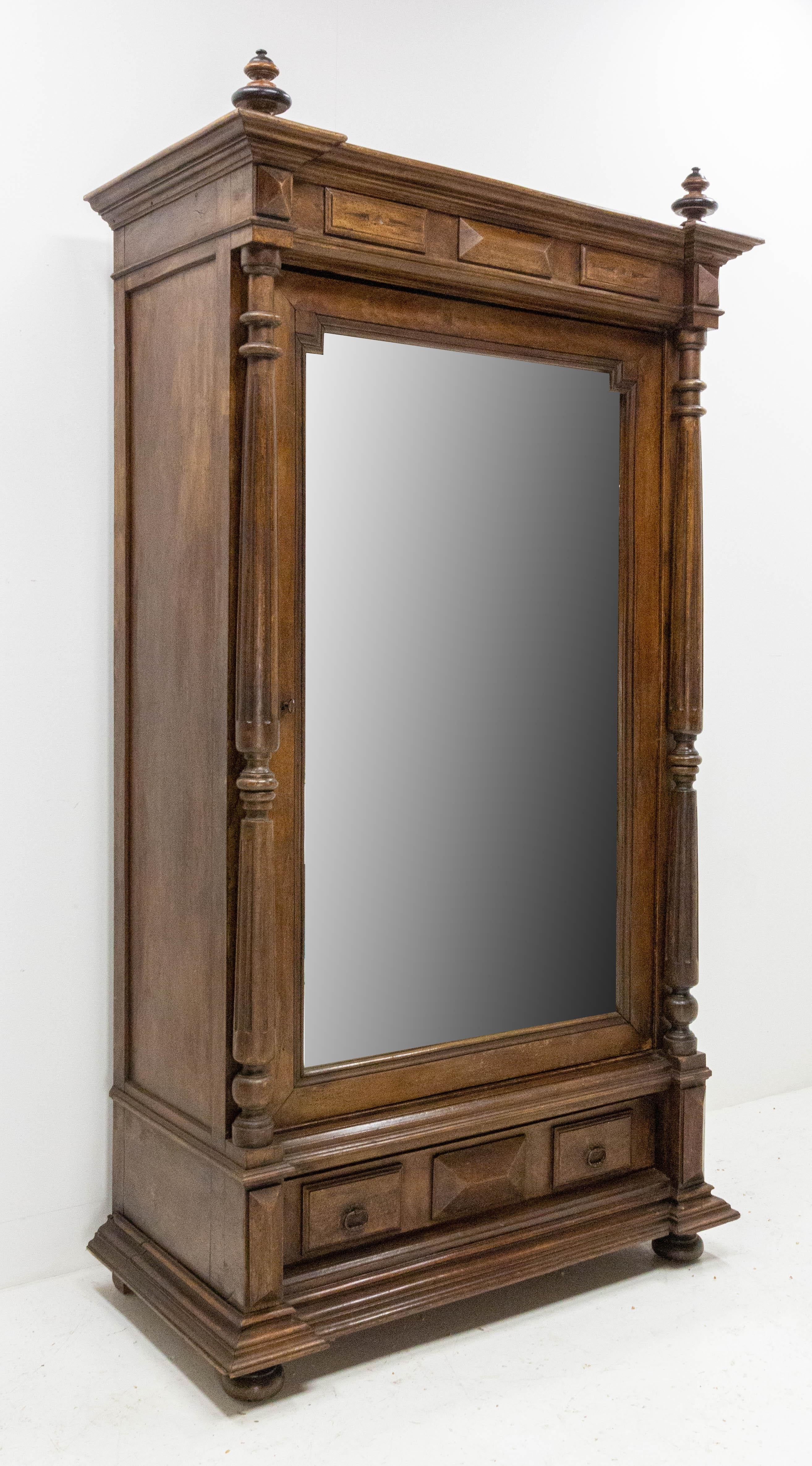 19th century armoire French Second Empire with columns
Mirror door
Three shelves and two hanging drawers
One big drawer
Shelves are all removable in height to create hanging space
Original mirrored door
Good antique condition solid and sound