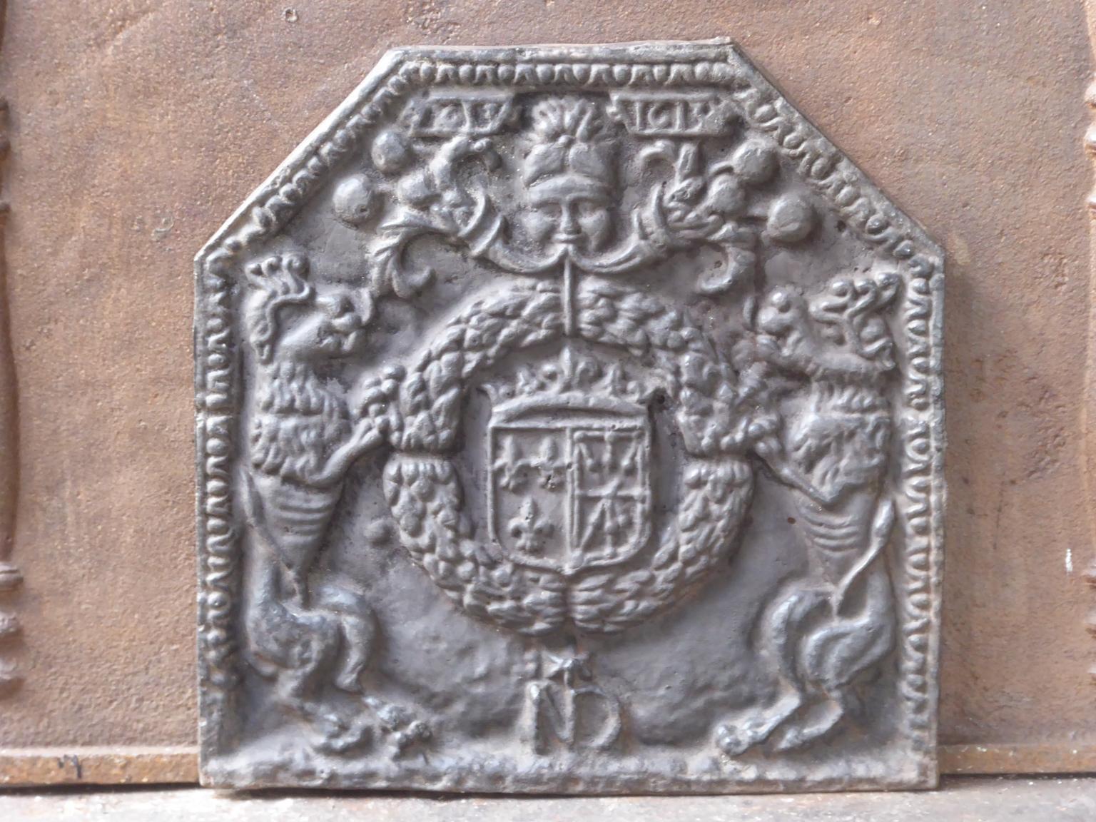 20th century French Louis III style fireback with the Arms of France and Navarre. 

Arms of the House of Bourbon from France, one of the major royal dynasties of Europe that produced monarchs Spain (Navarre), France, the two Sicilies and Parma.