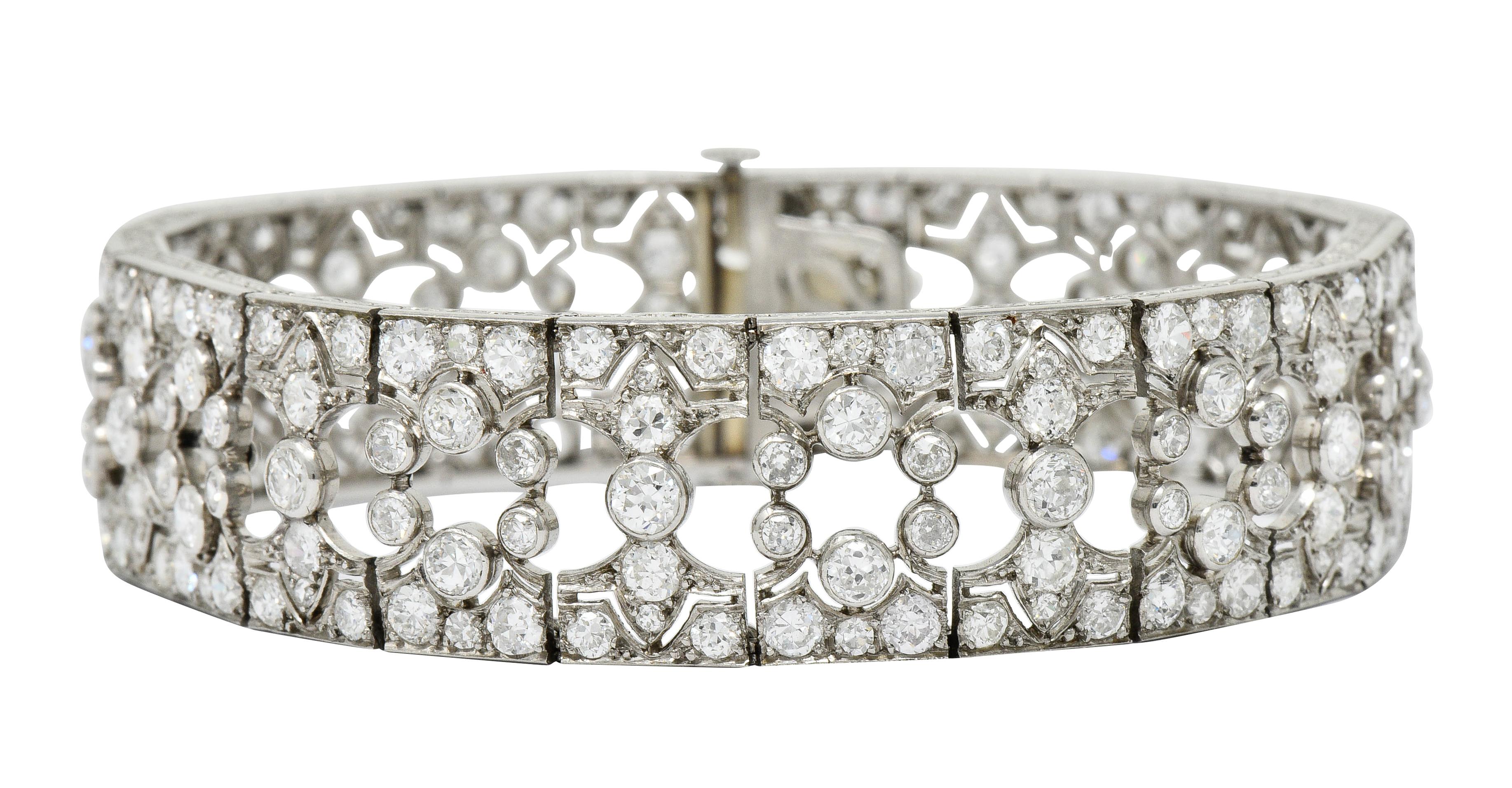 Wide bracelet comprised of pierced rectangular links featuring a fleur-de-lis design

Bead and bezel set throughout by old European, transitional, and single cut diamonds

Weighing in total approximately 12.50 carats with G to J color and VS to SI