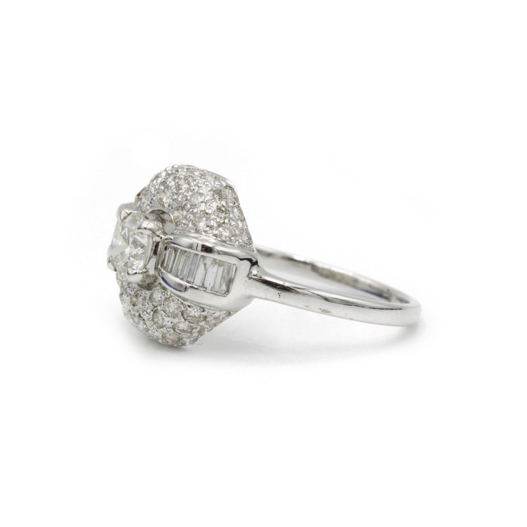 Elevate your vintage jewelry collection with this stunning Art Deco diamond ring, expertly crafted in France during the early 20th century. The octagonal bezel showcases a brilliant-cut center diamond (approximately 0.50 ct, F color, VS clarity),