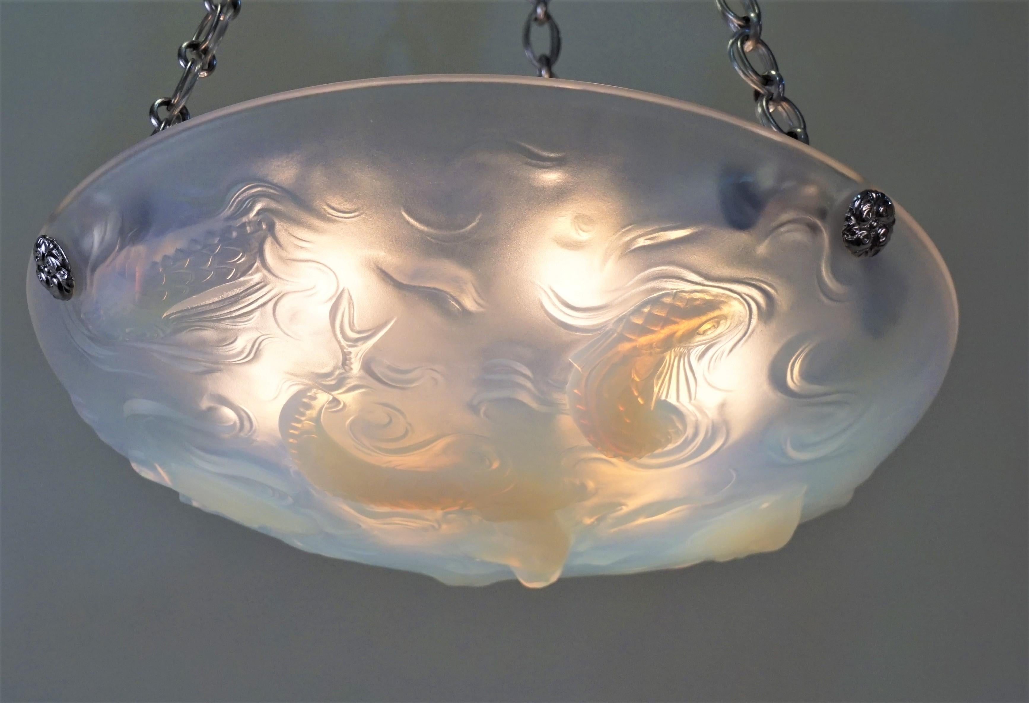 French Art Deco chandelier made honey blue opalescent glass with fish and mermaid swimming.
Six lights 60 watts max each