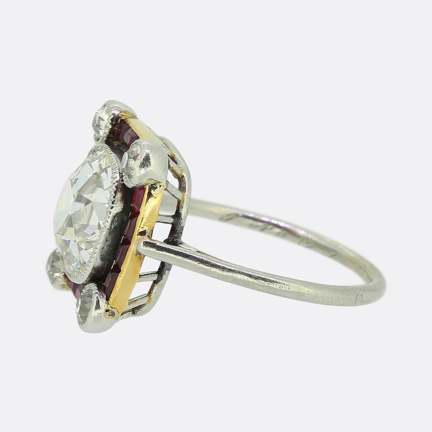 Here we have a truly remarkable cluster ring crafted in France at a time when Art Deco style was at the height of design. This chic and stylish piece has been crafted from platinum and showcases an outstanding old cushion cut diamond at the centre