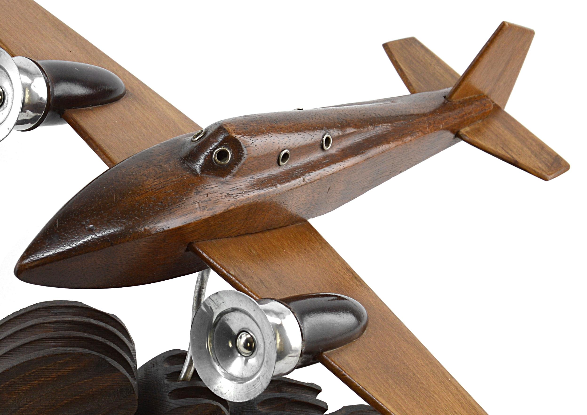 French Art Deco airplane on its wave by Anthoine Art Bois, France, circa 1935. Wood and metal.

 