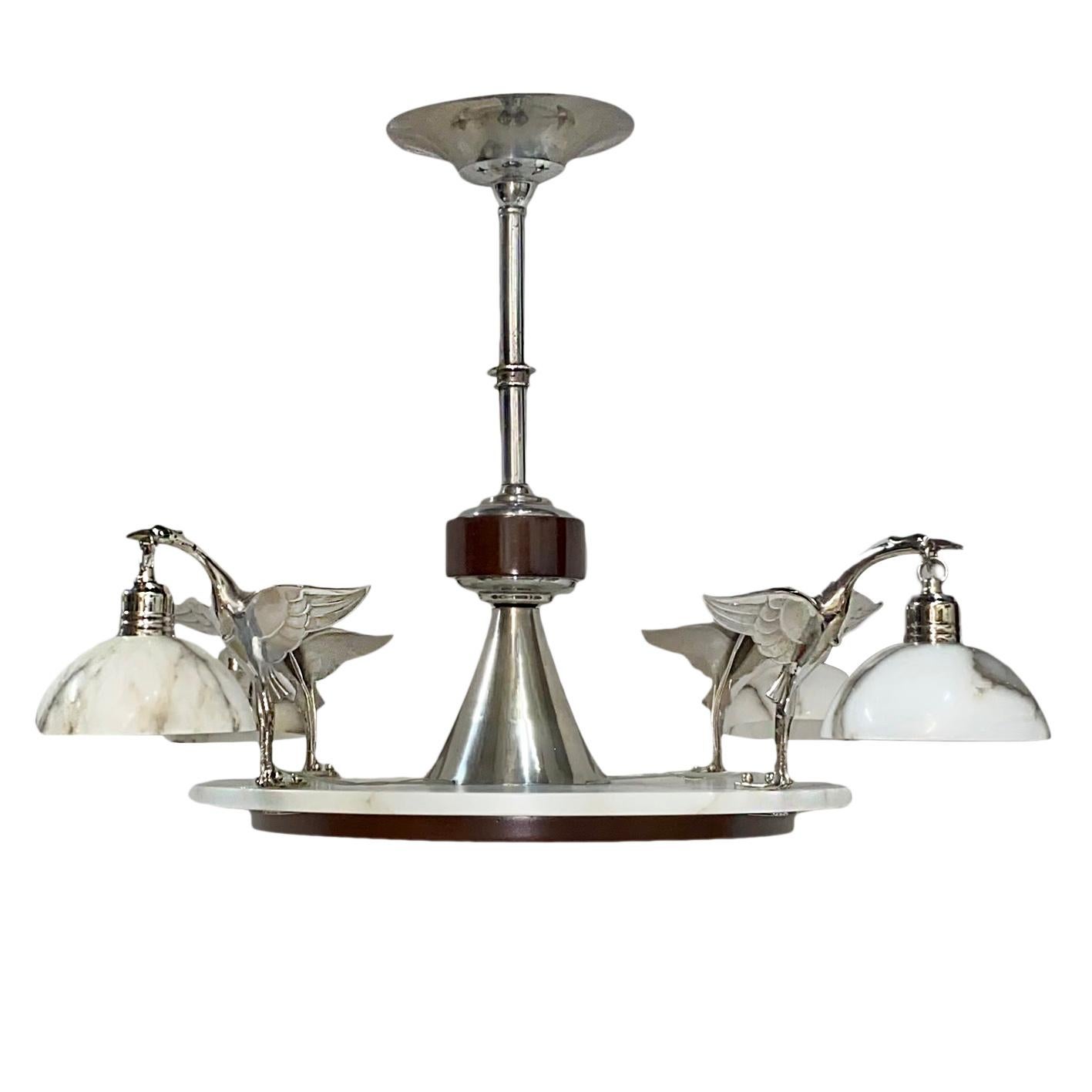 A circa 1940s French four-light chandelier with wood, alabaster and nickel-plated body.

Measurements:
Diameter 37