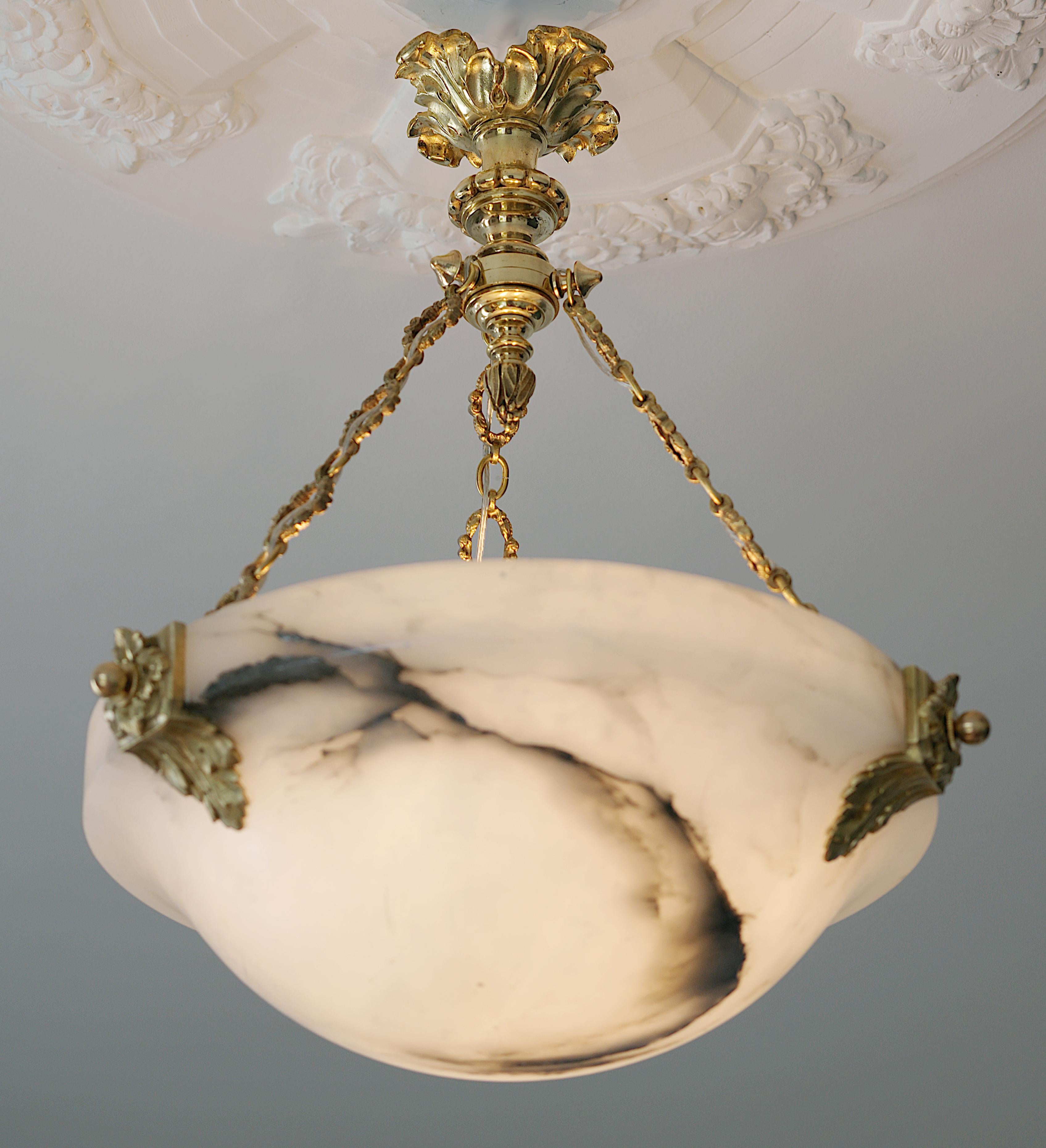 French ArtDeco alabaster and bronze pendant chandelier, France, 1920s. Alabaster shade hung at its gorgeous bronze fixture. Old alabaster cannot be compared to new ones. Old alabaster has veins. Sometimes they can be mistaken for cracks. But they