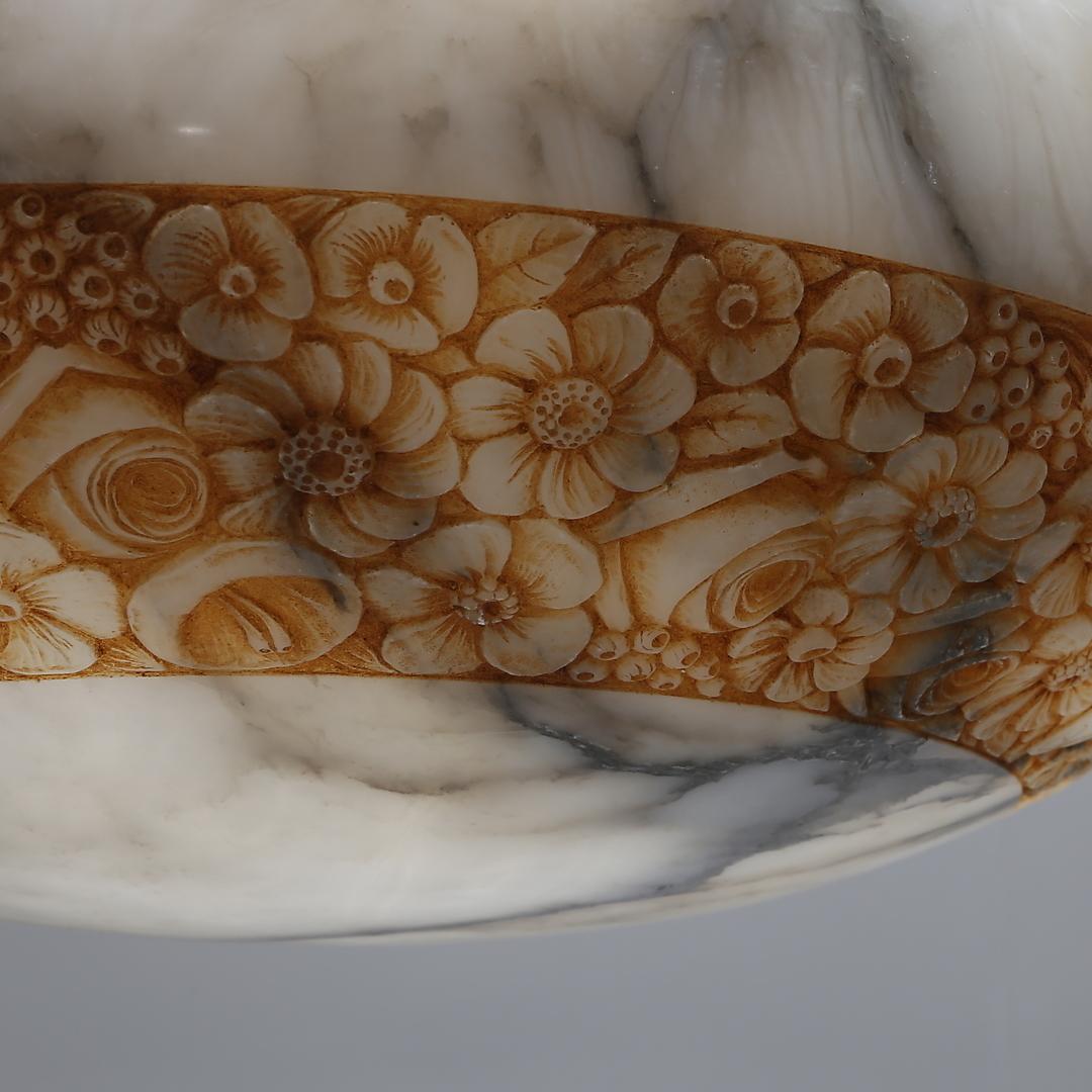 The shade is decorated (engraved) with floral and butterfly motifs. The thickness of the alabaster is about 1 cm (0.25in). The lamp gives a warm, ambient light and unusual effects, made in France in the 1920s.
Shade is still in good condition.
The