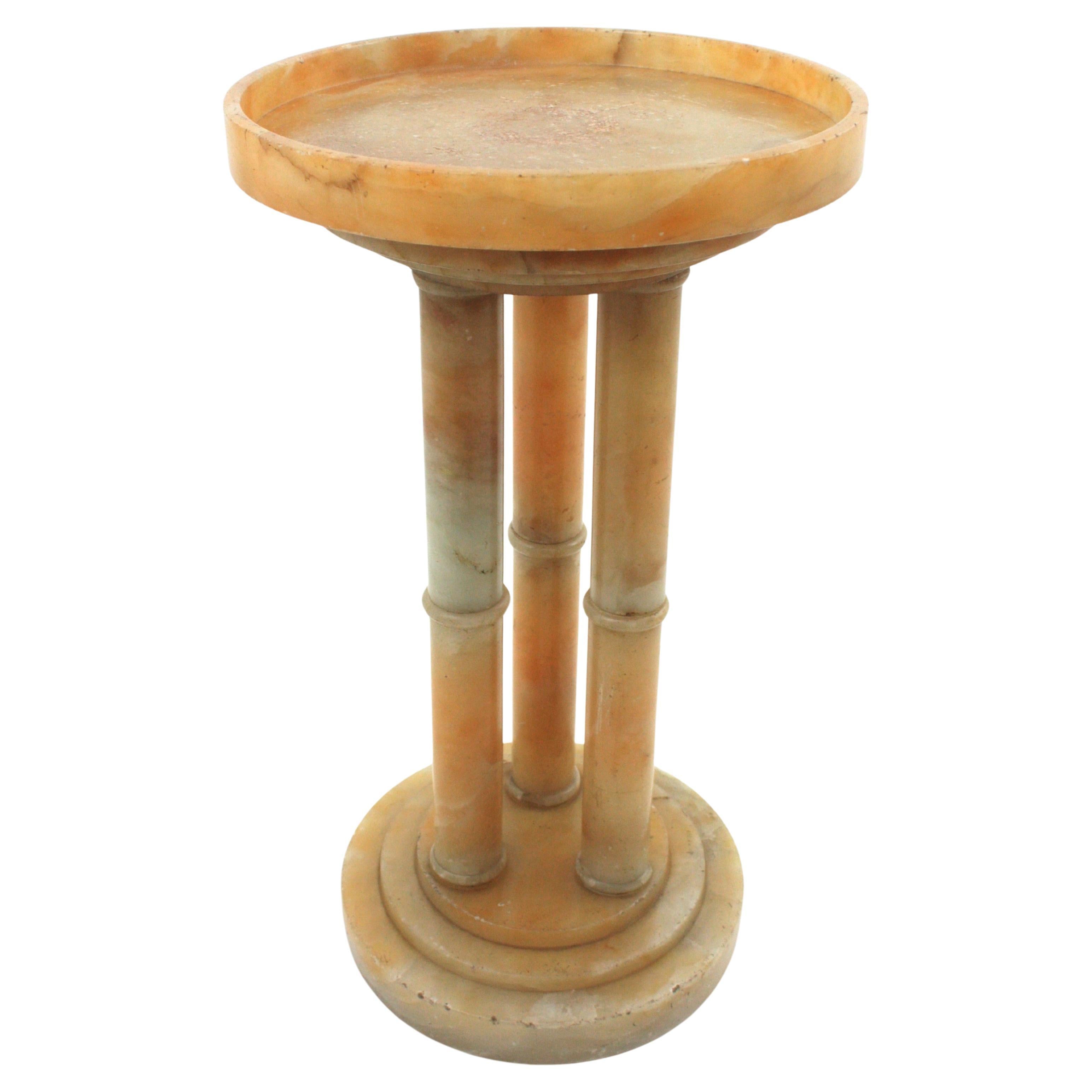 Alabaster Table with Triple Column Base, France, 1930-1940
Gueridon Side Table / Drinks Table in Turned Alabaster. Manufactured at the Art Deco Period.
Rare find.
Elegant alabaster side table with pedestal round base comprised by 3 columns holding