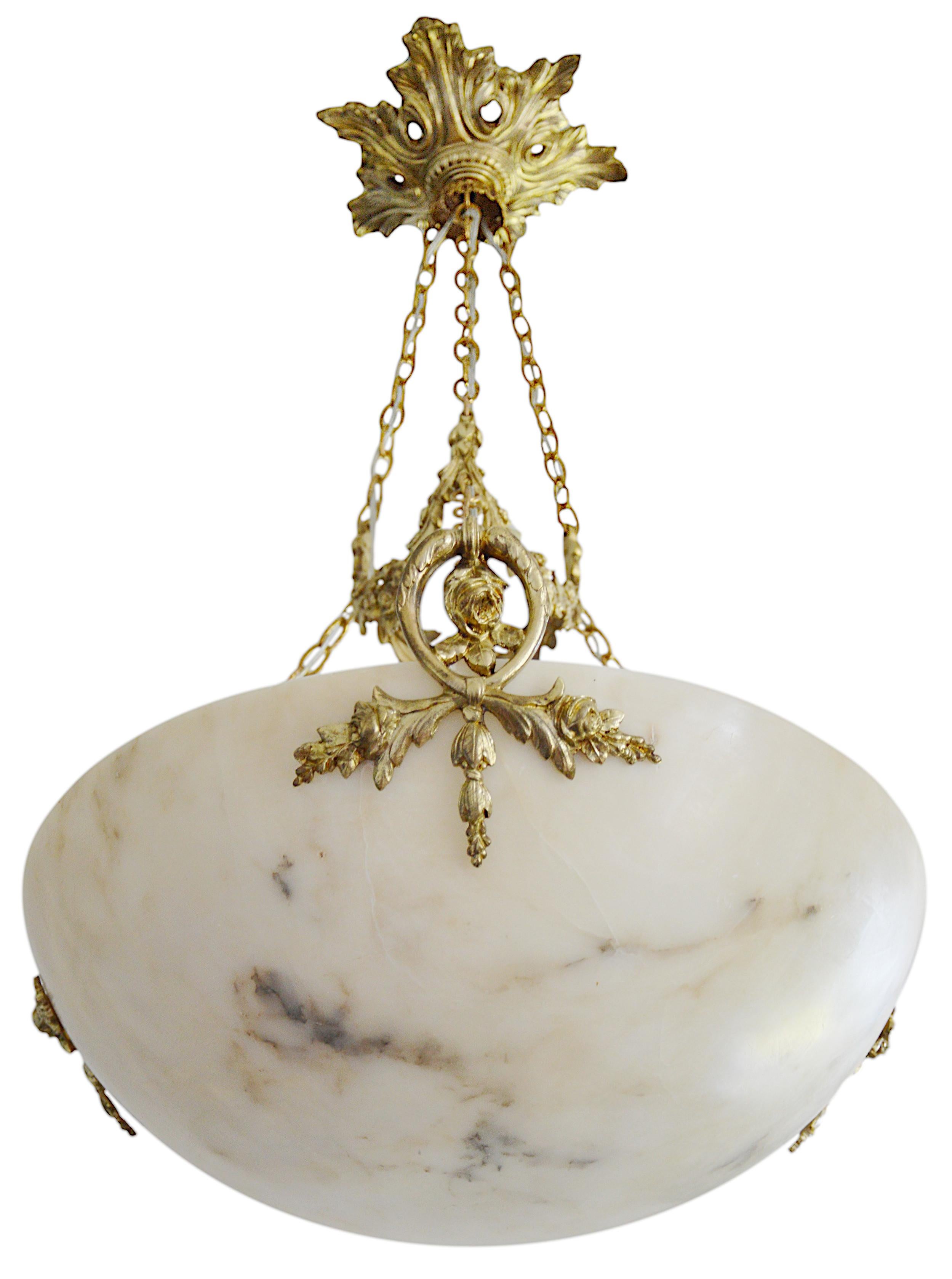 French Art Deco alabaster and bronze pendant chandelier, France, ca.1920. Alabaster shade hung at its bronze fixture. Old alabaster cannot be compared to new ones. Old alabaster has veins. Sometimes they can be mistaken for cracks. But they are not