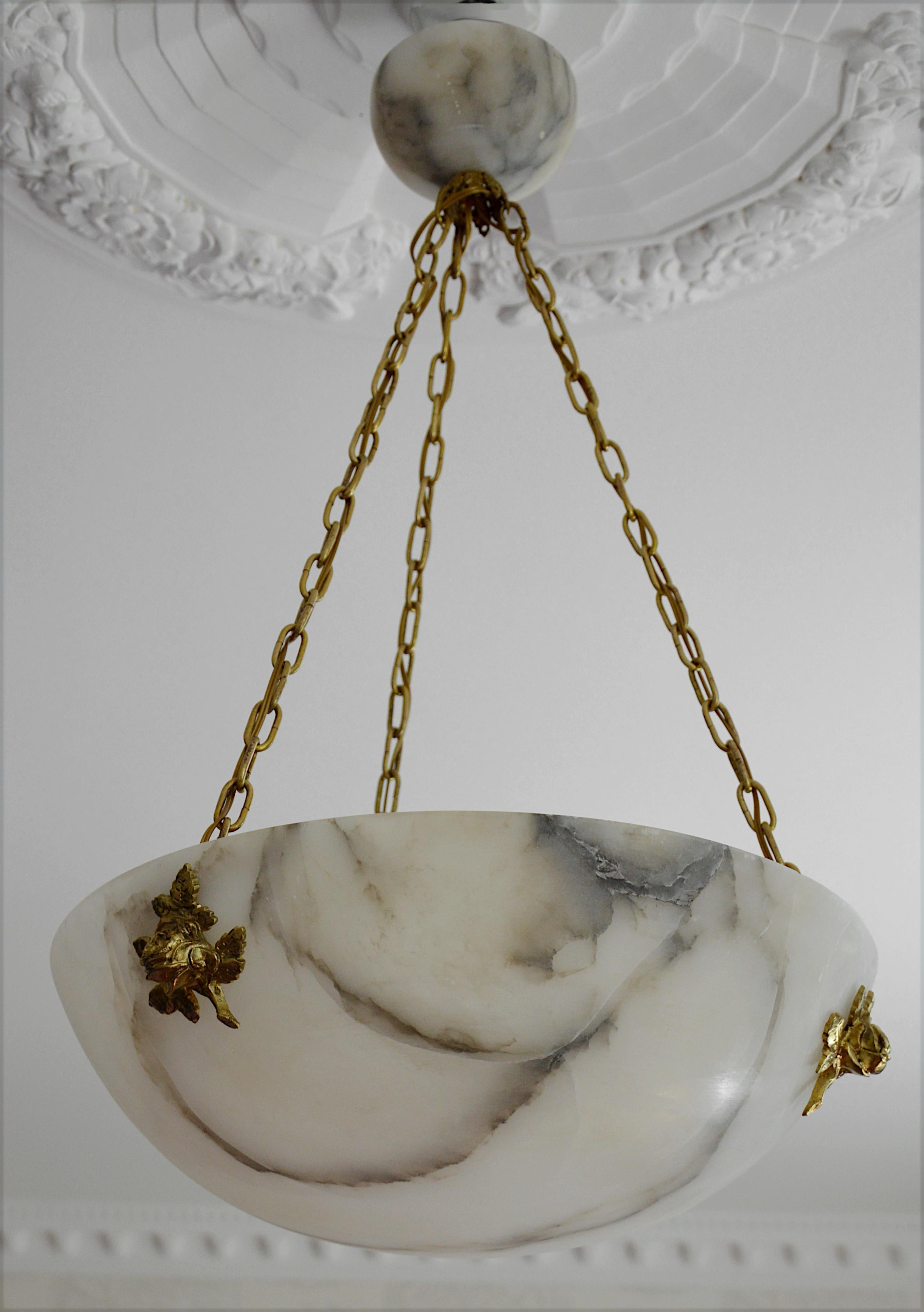 Summer sales. We are renewing our stock waiting for the start of September. Do not wait to order this beautiful piece. French Art Deco alabaster chandelier, France, 1920s. Alabaster bronze and brass. Alabaster shade hung on its original fixture