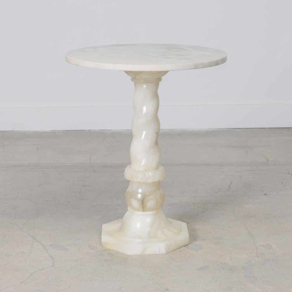 Beautiful Art Deco side table from France, 1930s. Wonderful ornately carved alabaster pedestal base with round marble top. Lovely and functional piece with great design. 