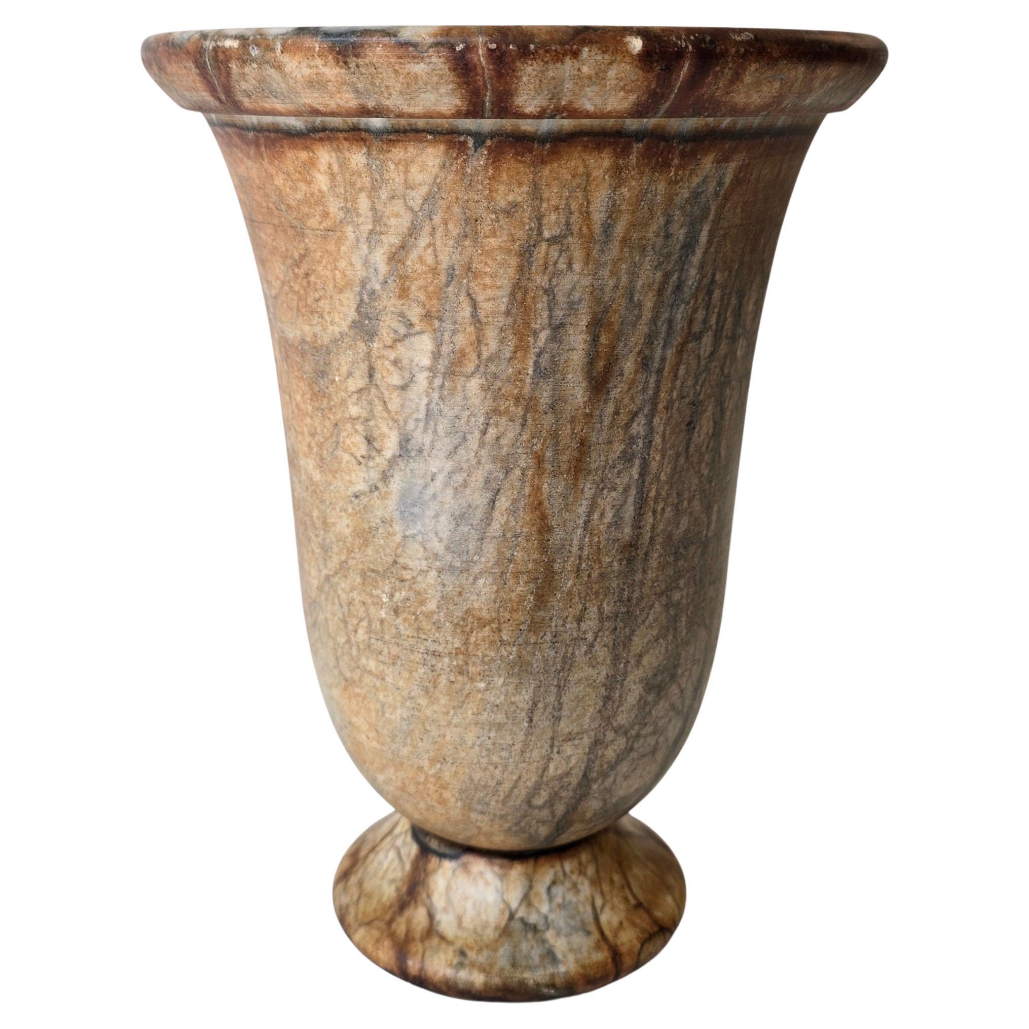 French Art Deco Alabaster Table Lamp, France, circa 1920s

Elegant table lamp made of carved alabaster in the shape of a classical urn. When lit, the translucent stone emits a warm and atmospheric glow. The delicate natural veining in the alabaster