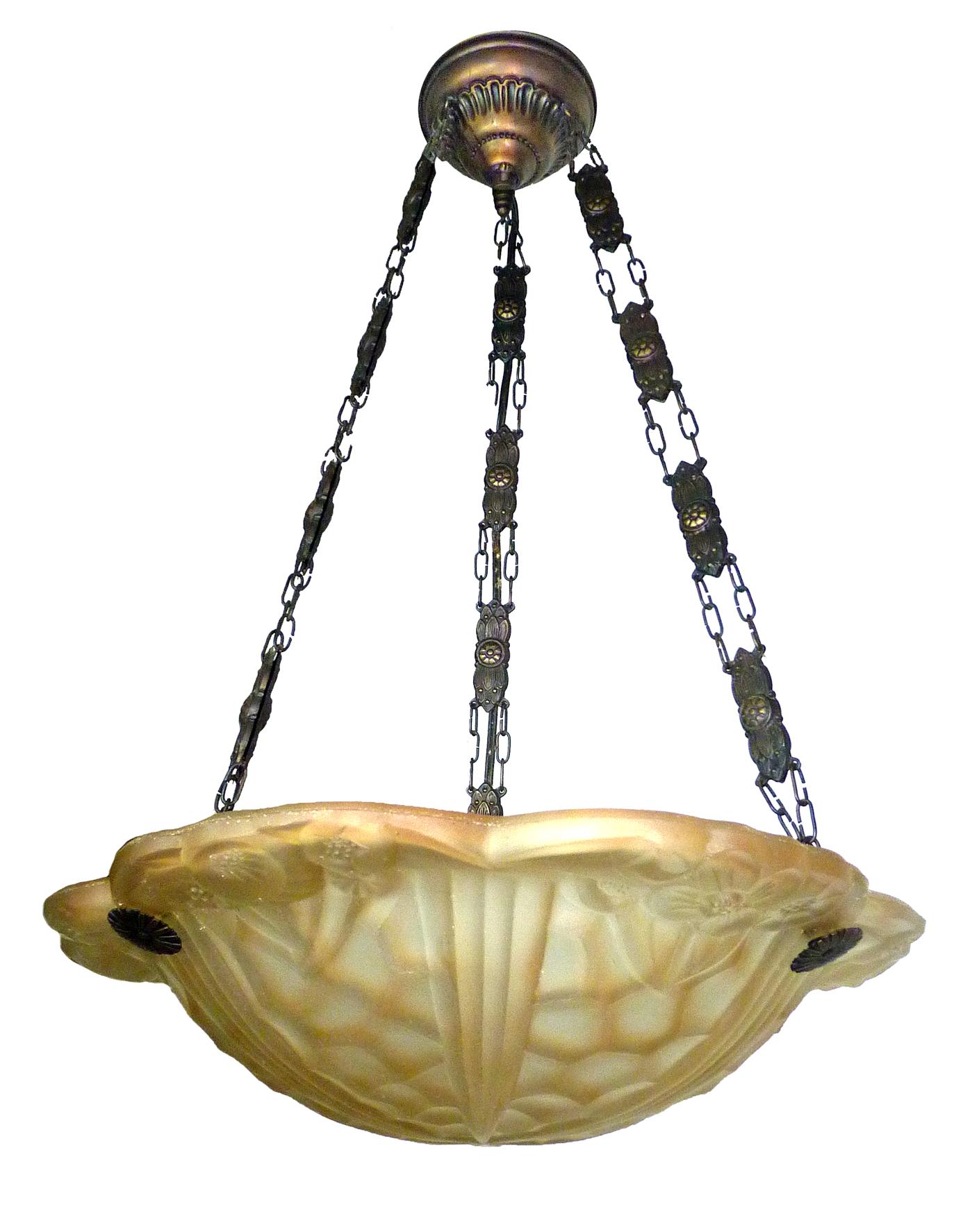 Beautiful French Art Deco chandelier or pendant with amber glass shade with floral and geometric pattern in the style of Degué.
Measures:
Width 16 in / 40 cm
Height 26 in / 65 cm
Weight 12 lb. (5 kg)
One light bulb E 27 / good working