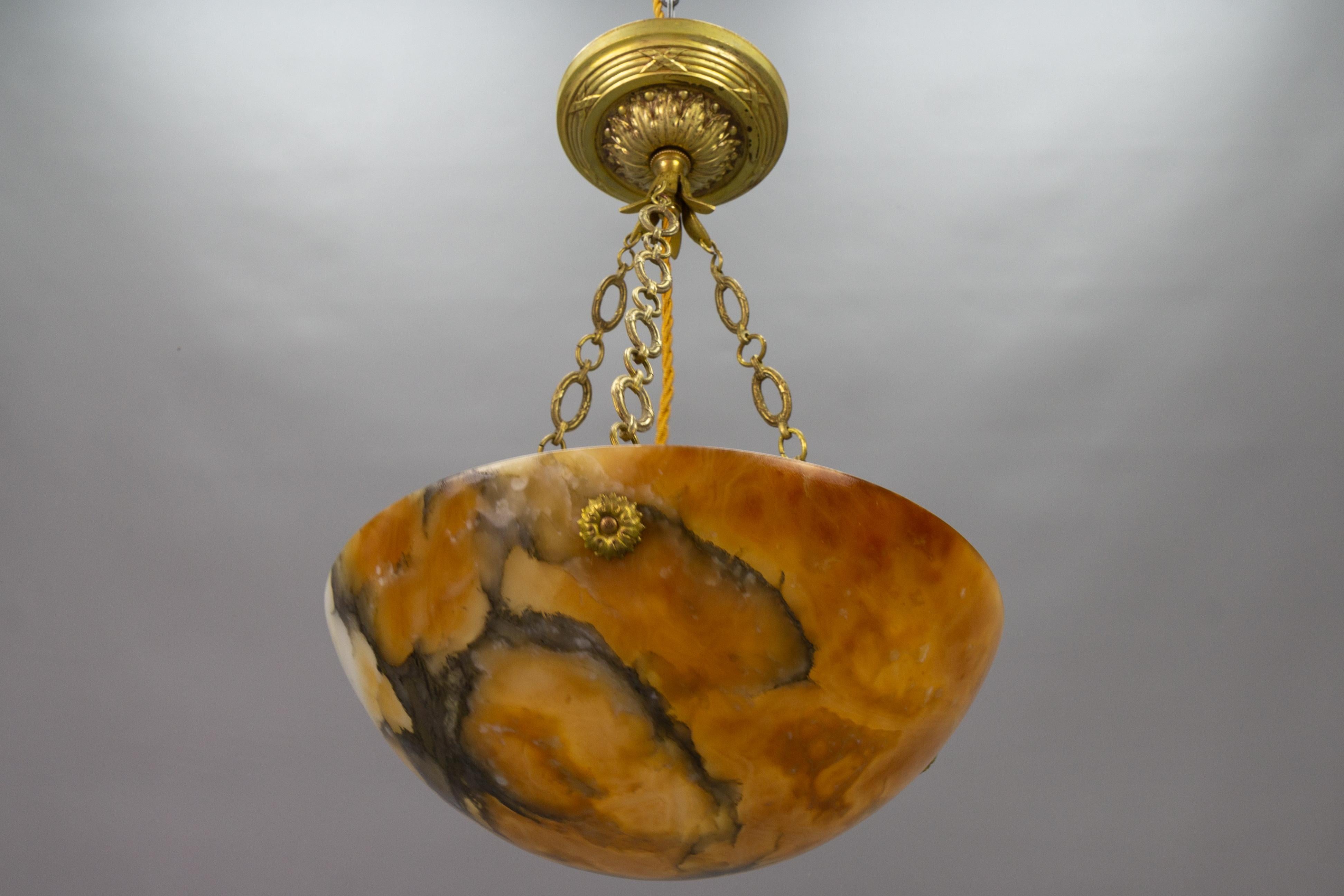 Early 20th Century French Art Deco Amber Color Alabaster and Bronze Pendant Light, circa 1920 For Sale