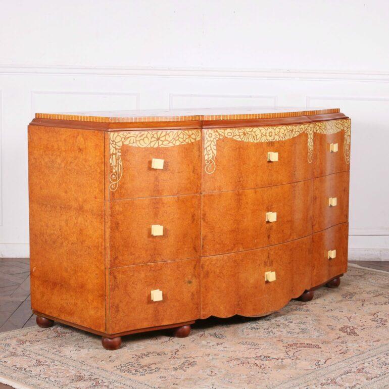 This elegant sideboard, created in 1929 for “Maison D.I.M.” by famed designers René Jouvert and Philippe Petit, is a stunning example of French Art Deco design. Both timeless and versatile in design, it features a stunning Amboyna grain across the